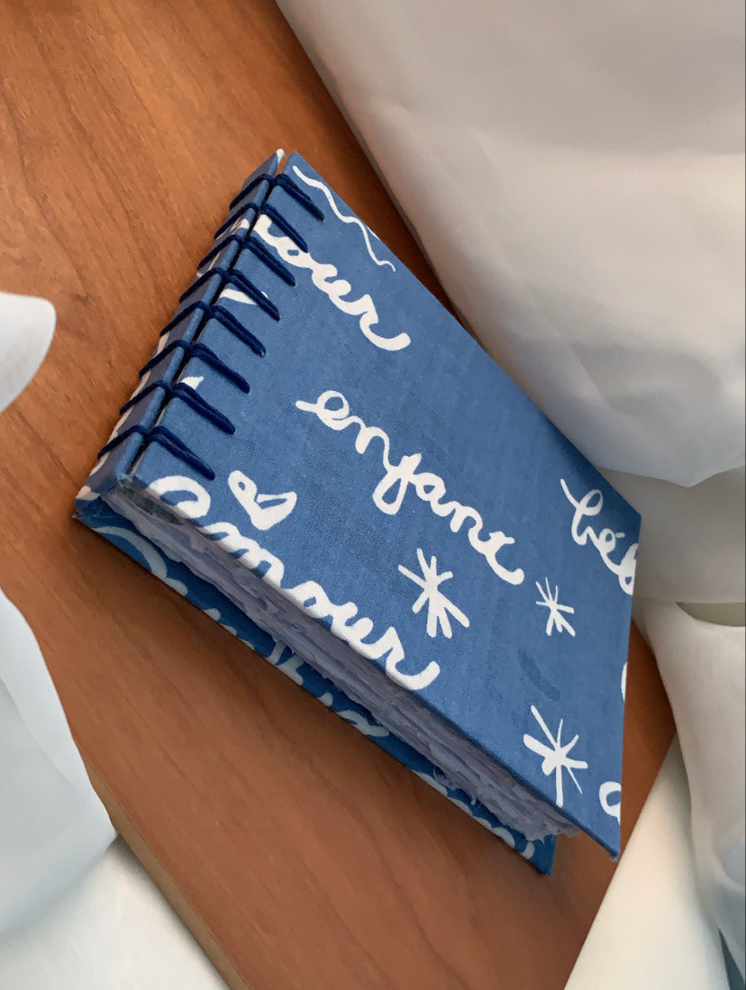 Secret Belgian Binding with book cloth and blueberry paper