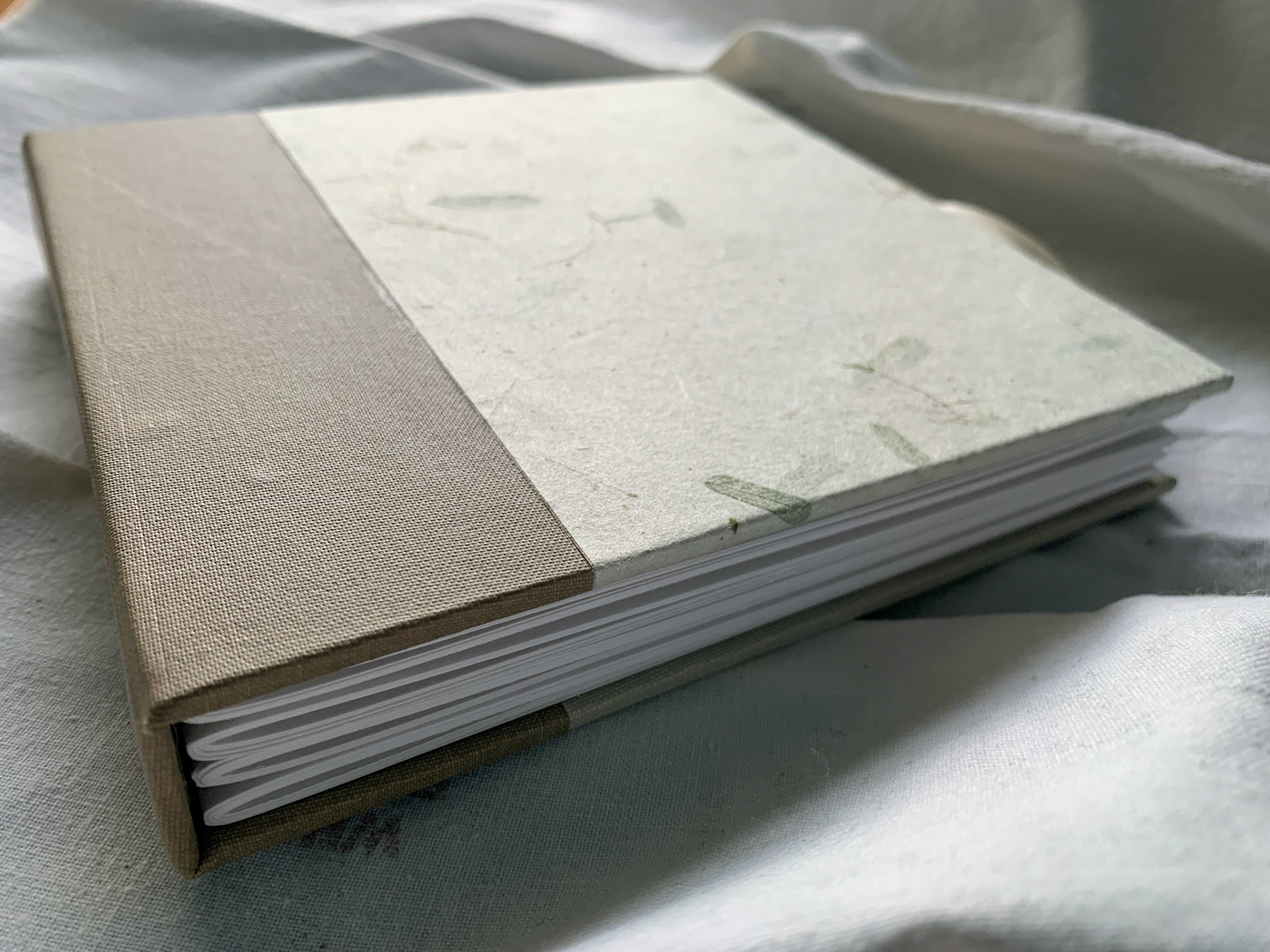 Sewn Signature Album with cover closure ribbons, 2022