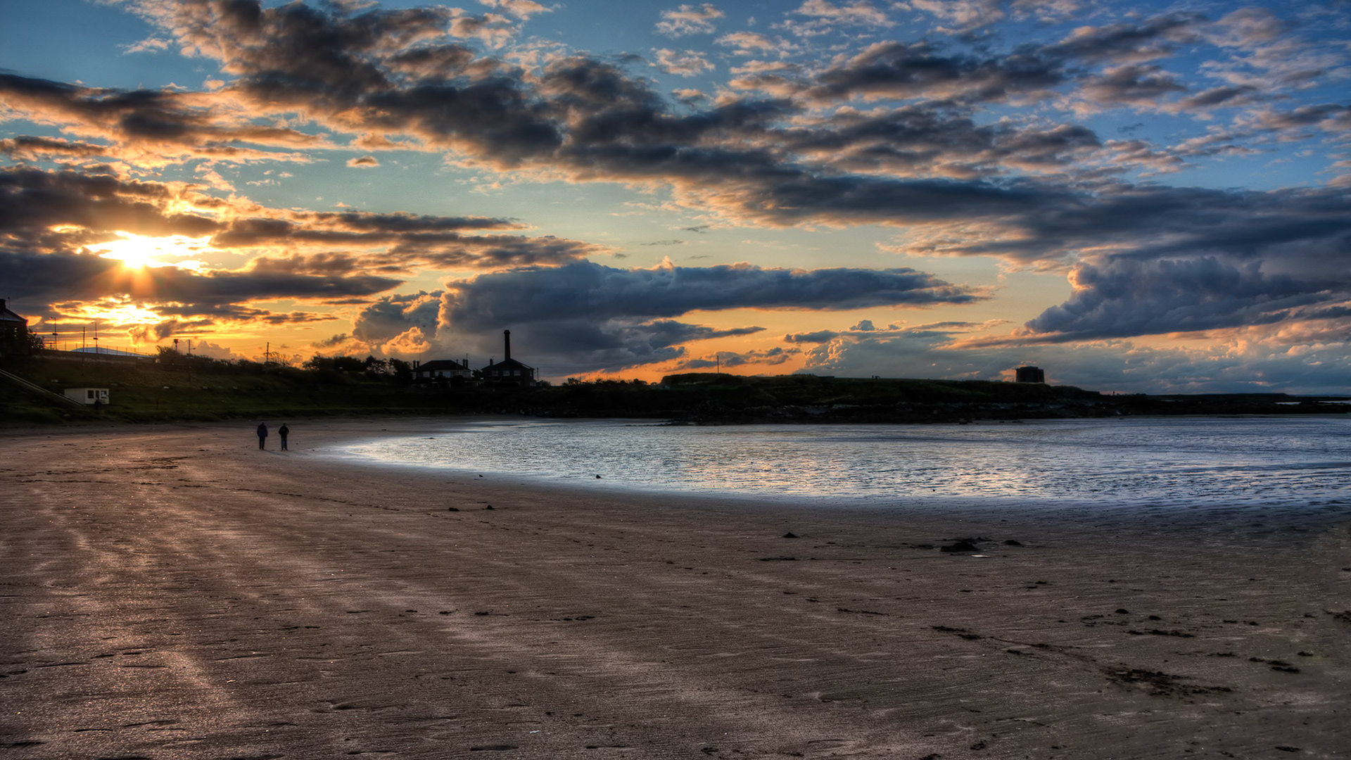 HDR composed of 3 shots. Handheld with a Canon EOS 40D.Just an hour ago it was raining and that cleared up the air and gave the sunset an amazingly intense coloration. A light breeze was bringing up some really nice clouds. The image can't reveal all the beauty of this sunset.