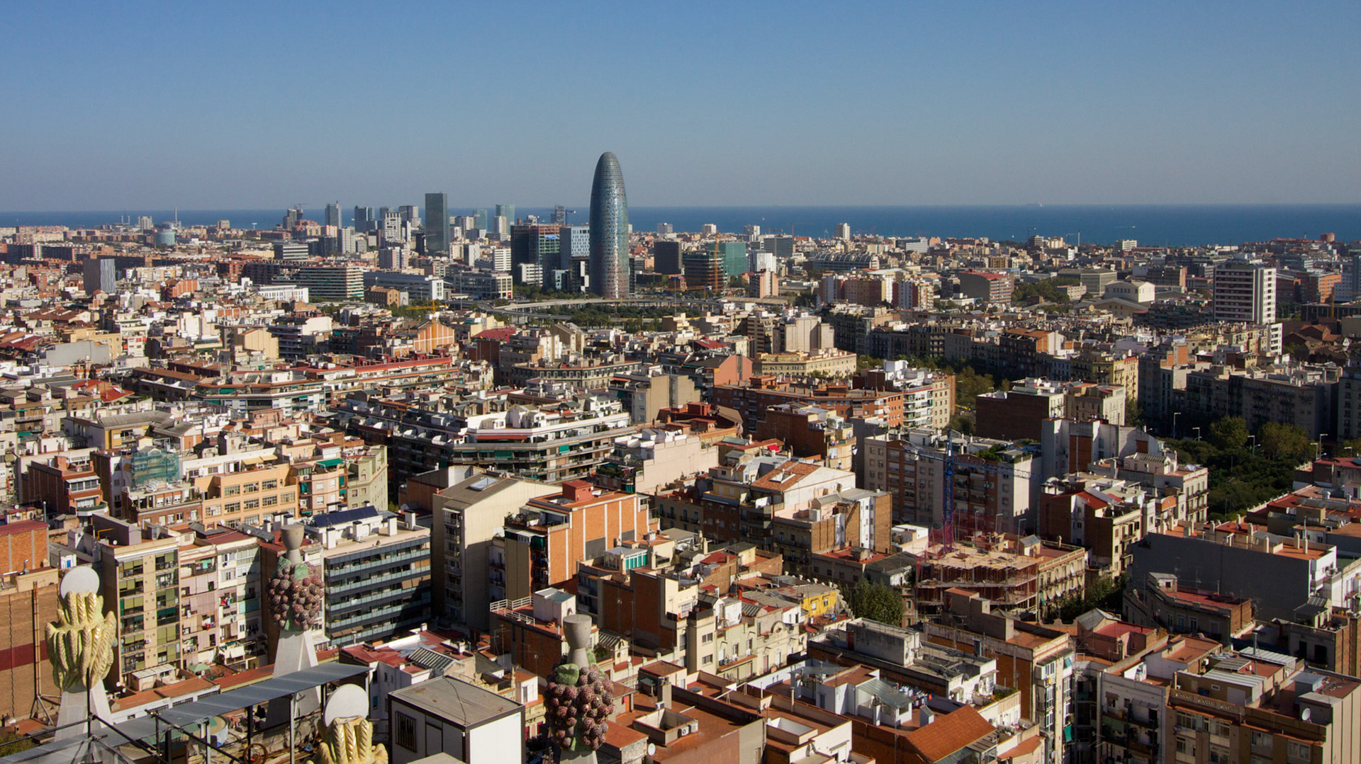 Panorama view from the Sagrade Familia over Barcelona. In the back there is the Torre Agbar.