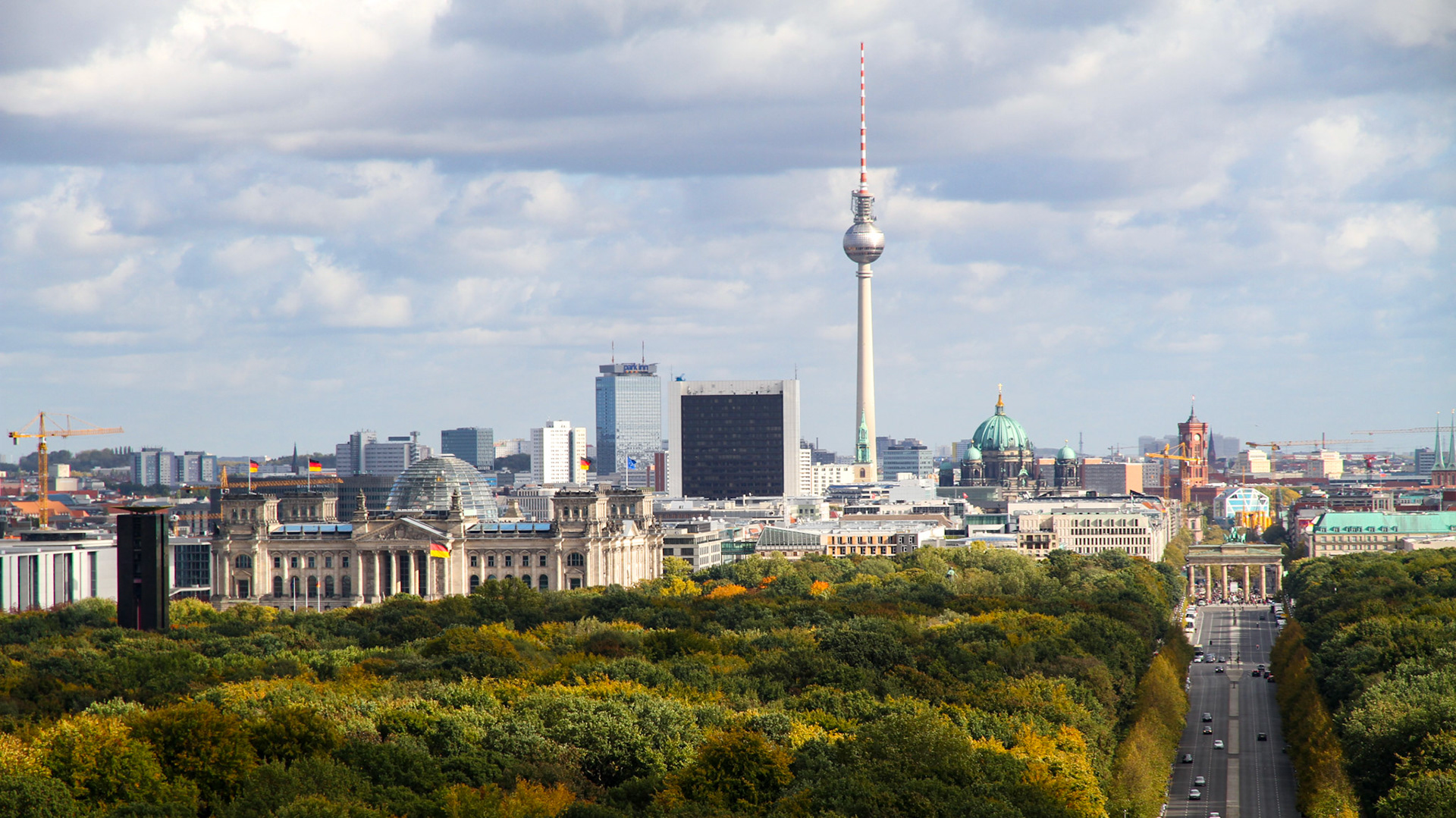 Berlin Tiergarten and the iconic TV Tower and Brandenburg Gate in the back.