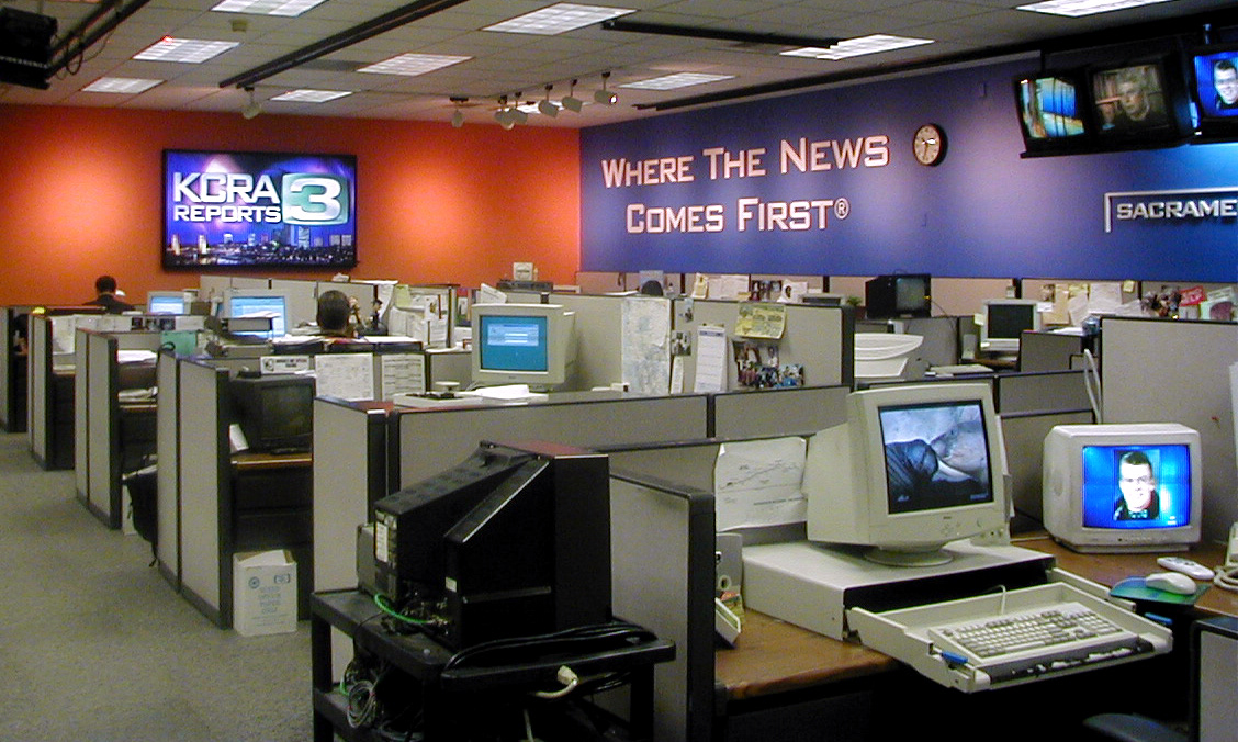 newsroom monitor graphic and signage