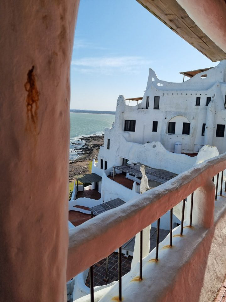 The unique contours of Casa Pueblo frame the tranquil Uruguayan shoreline, a blend of art and nature's majesty