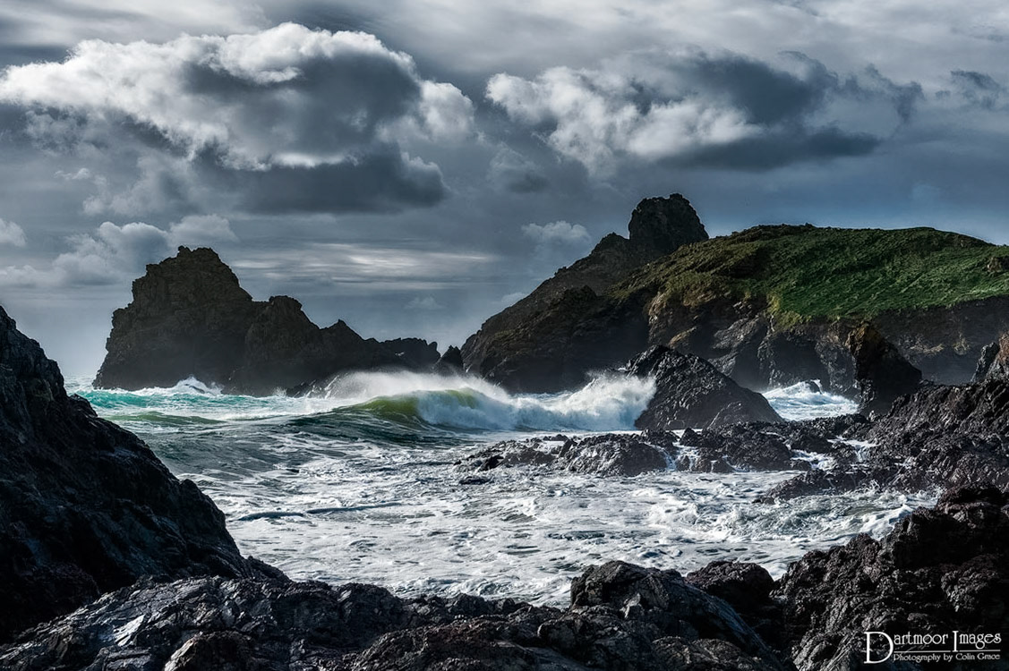 High winds and an overnight storm produce large and fast waves that crash against the rocks at the National Trust property of Kynance Cove on The Lizard in southern Cornwall.