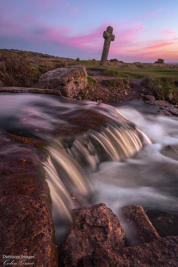 Windy Post Cross and Leat during a colourful sunset on Dartmoor.