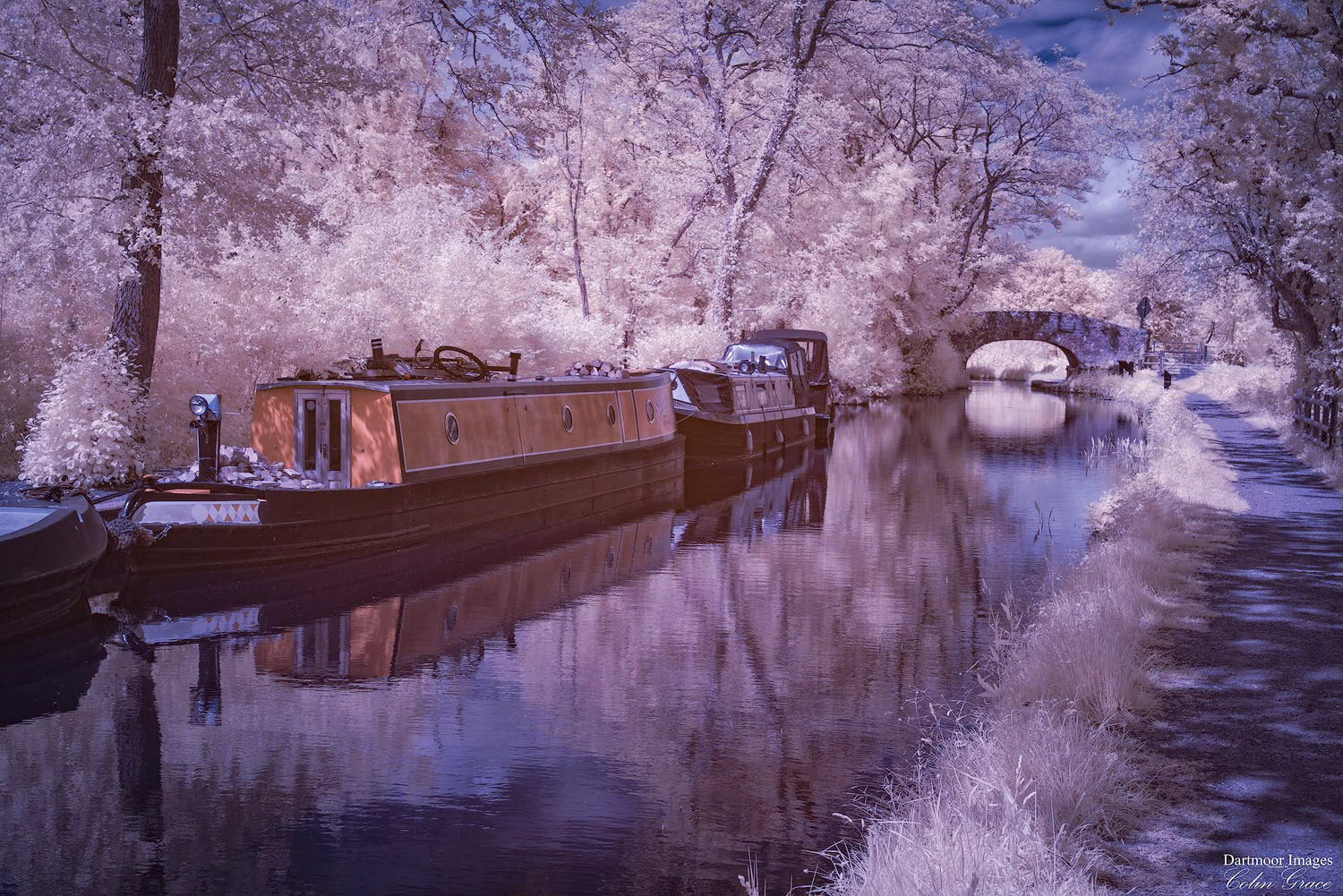 A false colour infra red image of canal boats moored alongside the Monmouthshire and Brecon Canal at Goytre Wharf in South Wales.