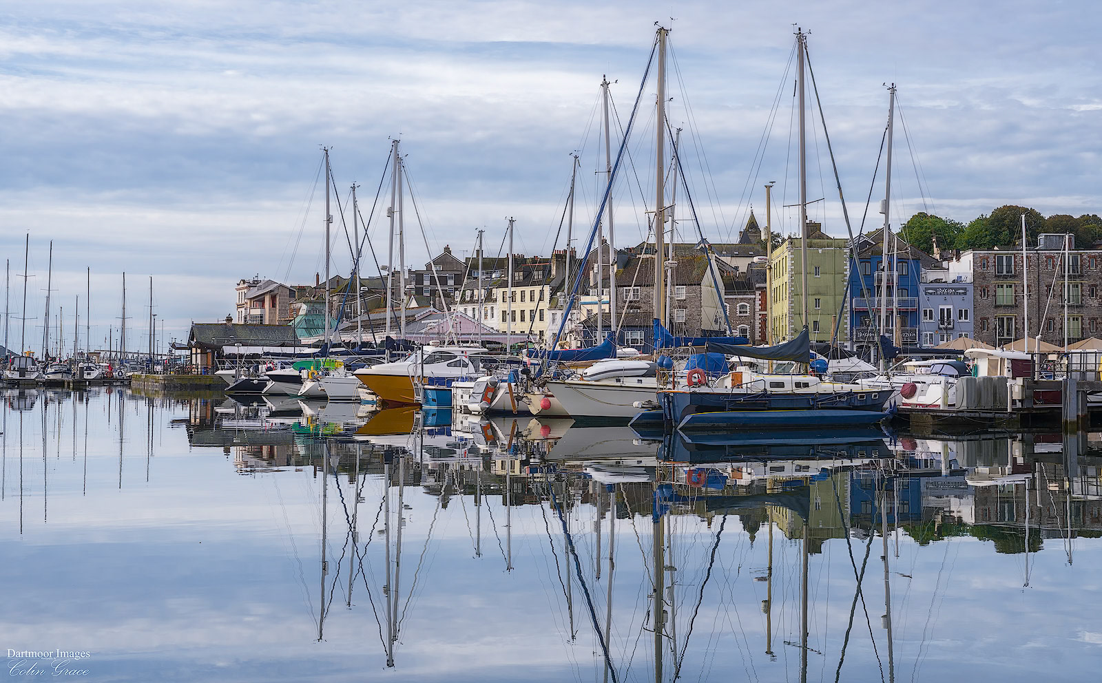 Yachts reflected the still waters of Sutton Harbour in Plymouth.