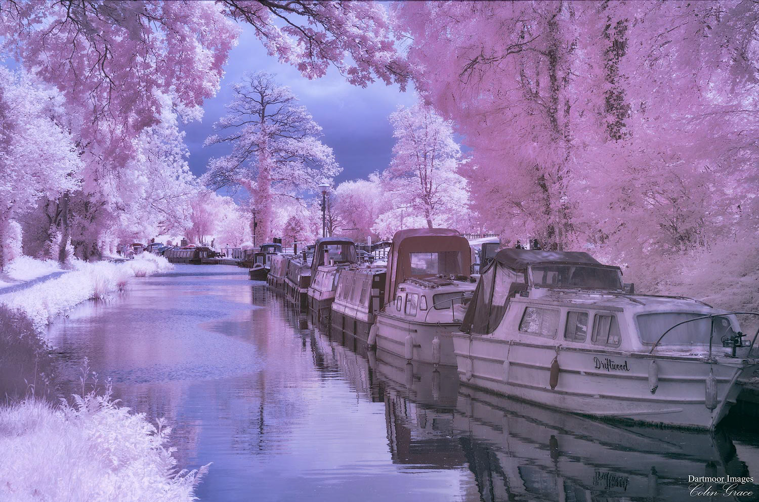 A false colour infra red image of canal boats moored alongside the Monmouthshire and Brecon Canal at Goytre Wharf in South Wales.