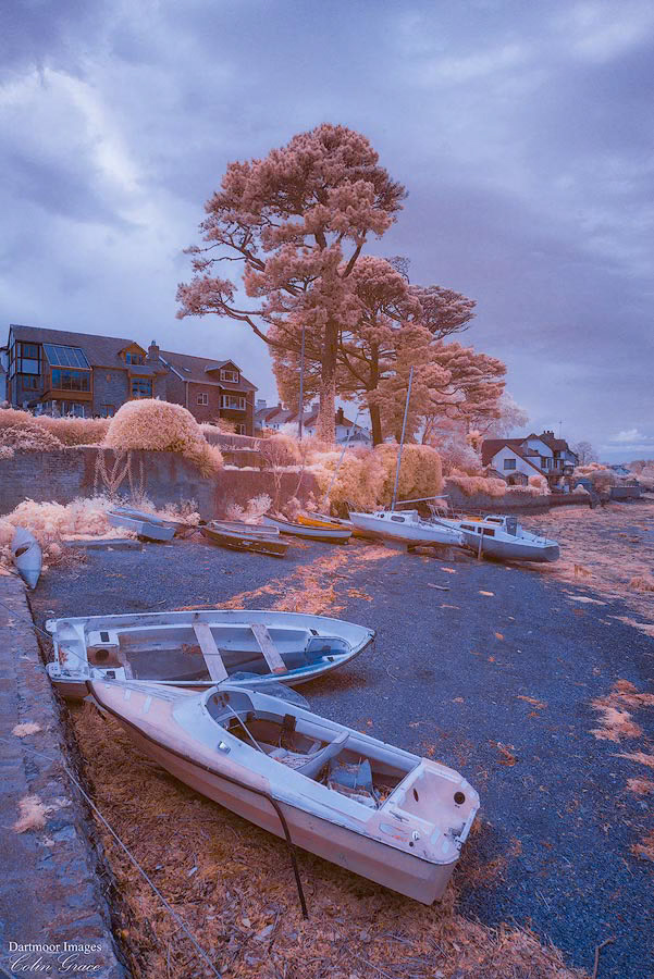 Low tide on the River Tamar leaves small boats high and dry on the shoreline at Saltash.