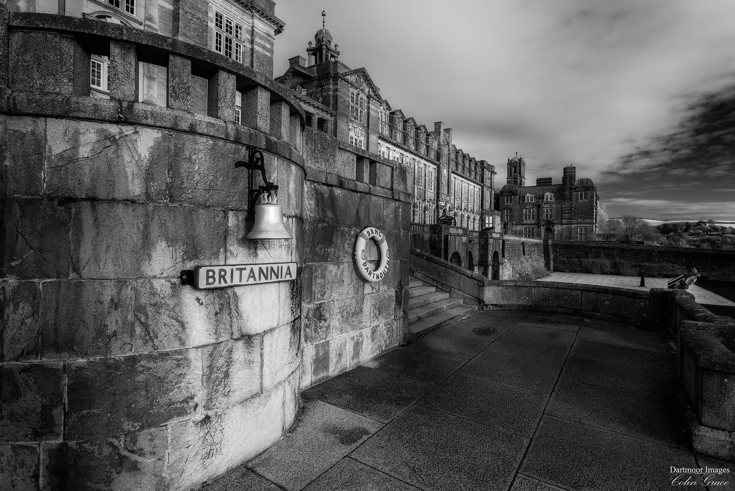 The ships bell and lifebuoy by the steps leading up to the main building of Britannia Royal Navy College, in Dartmouth Devon.