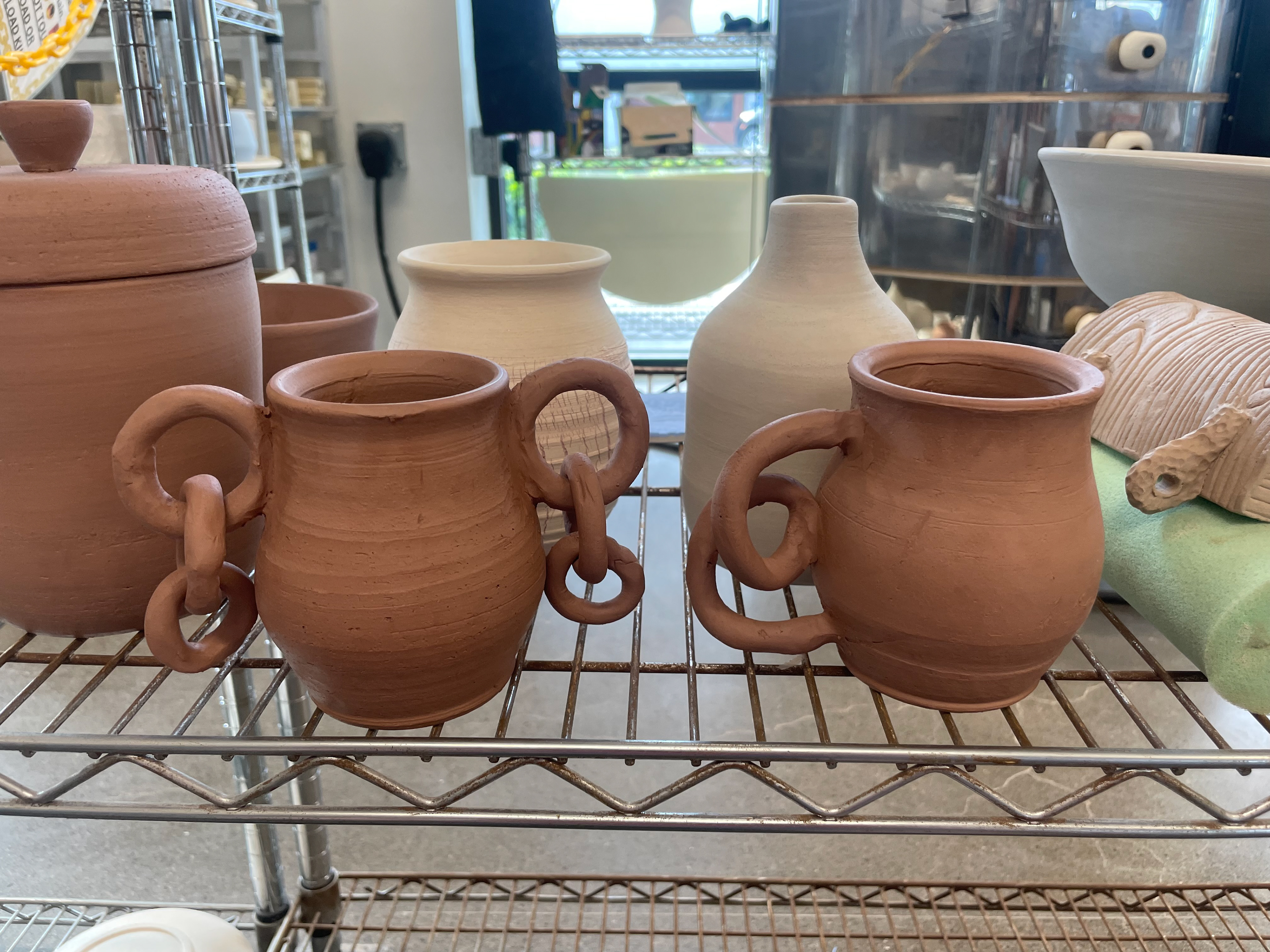 Abstract Handle Mugs: I got the idea for these guys while falling asleep one night. I thought it would really itch my brain to make a mug with weirdly coiled handles.