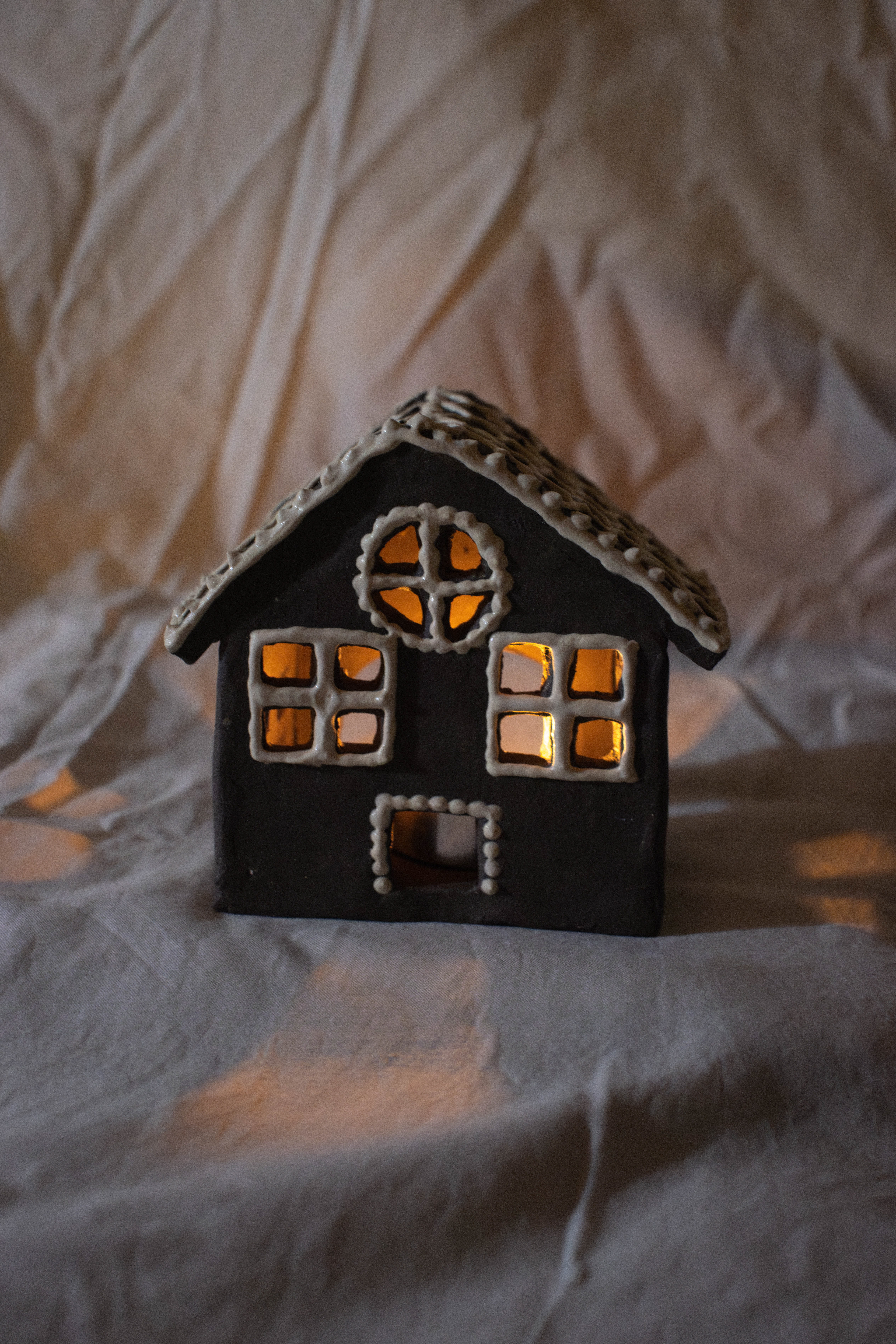 Gingerbread House: This was my favorite piece I made for my first craft fair in 2024. I used this insane texture of dark clay and sculpted the house structure. Then, I snuck some white clay scraps from the reclaim bucket and made slip to resemble icing. I took a pipette to the exterior of the house and the rest is history. Oddly enough, none of these sold but I got tons of complements...?