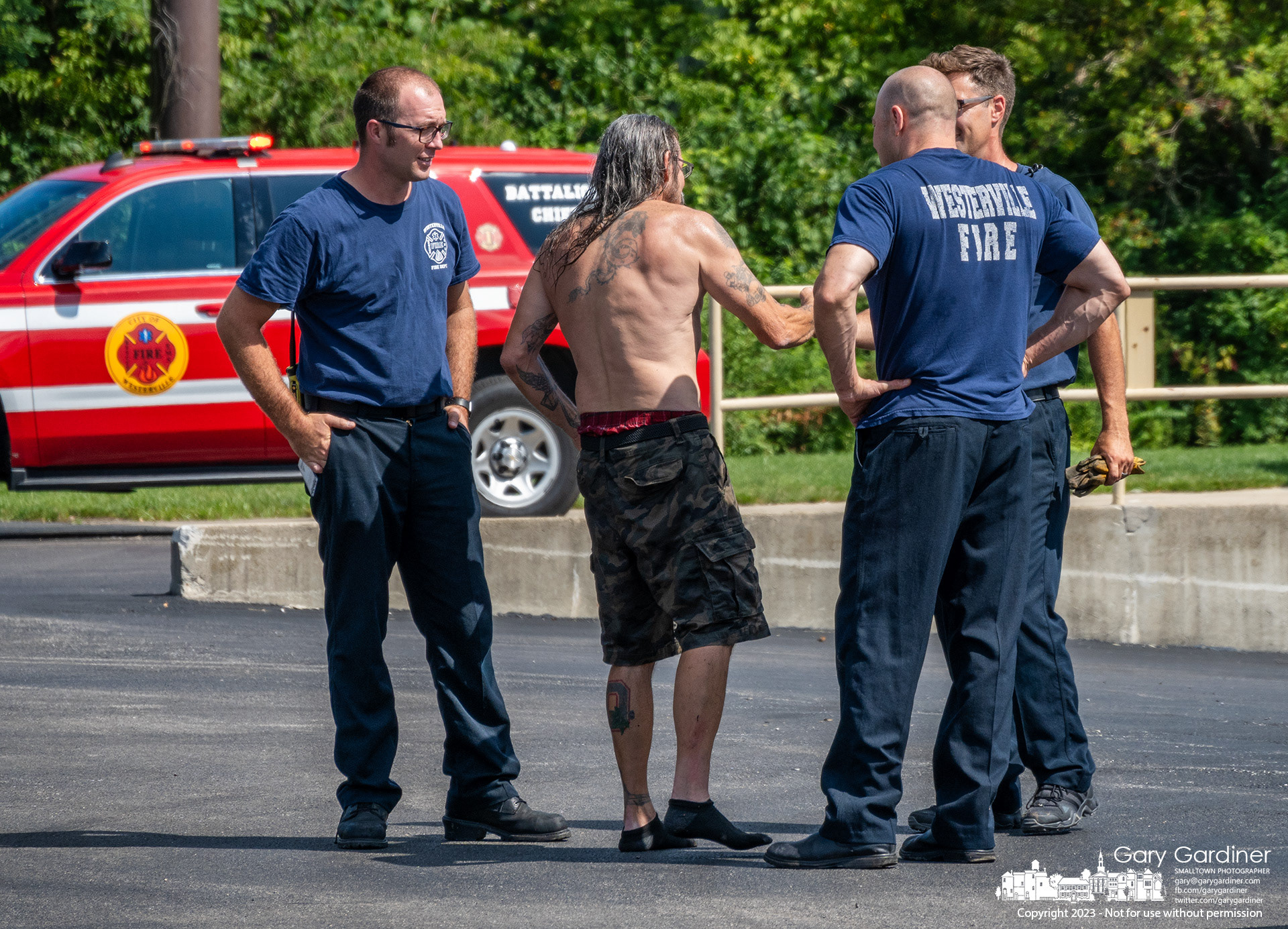 A man who rode his kayak over the low head dam at Alum Creek Park North in Westerville offers a thank you and a handshake to some if the Westerville firefighters who came to his aid. My Final Photo for August 26, 2023. https://bit.ly/3R1T32N