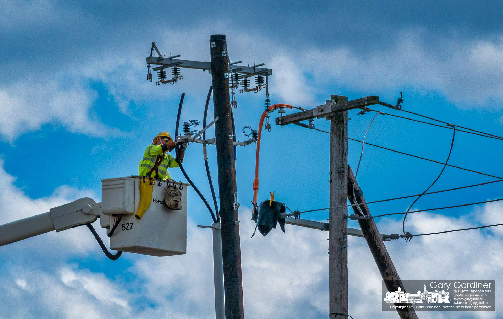 A city electrical worker installs new cables that will direct power underground to the substation being upgraded on Collegeview Ave. My Final Photo for March 24, 2021.