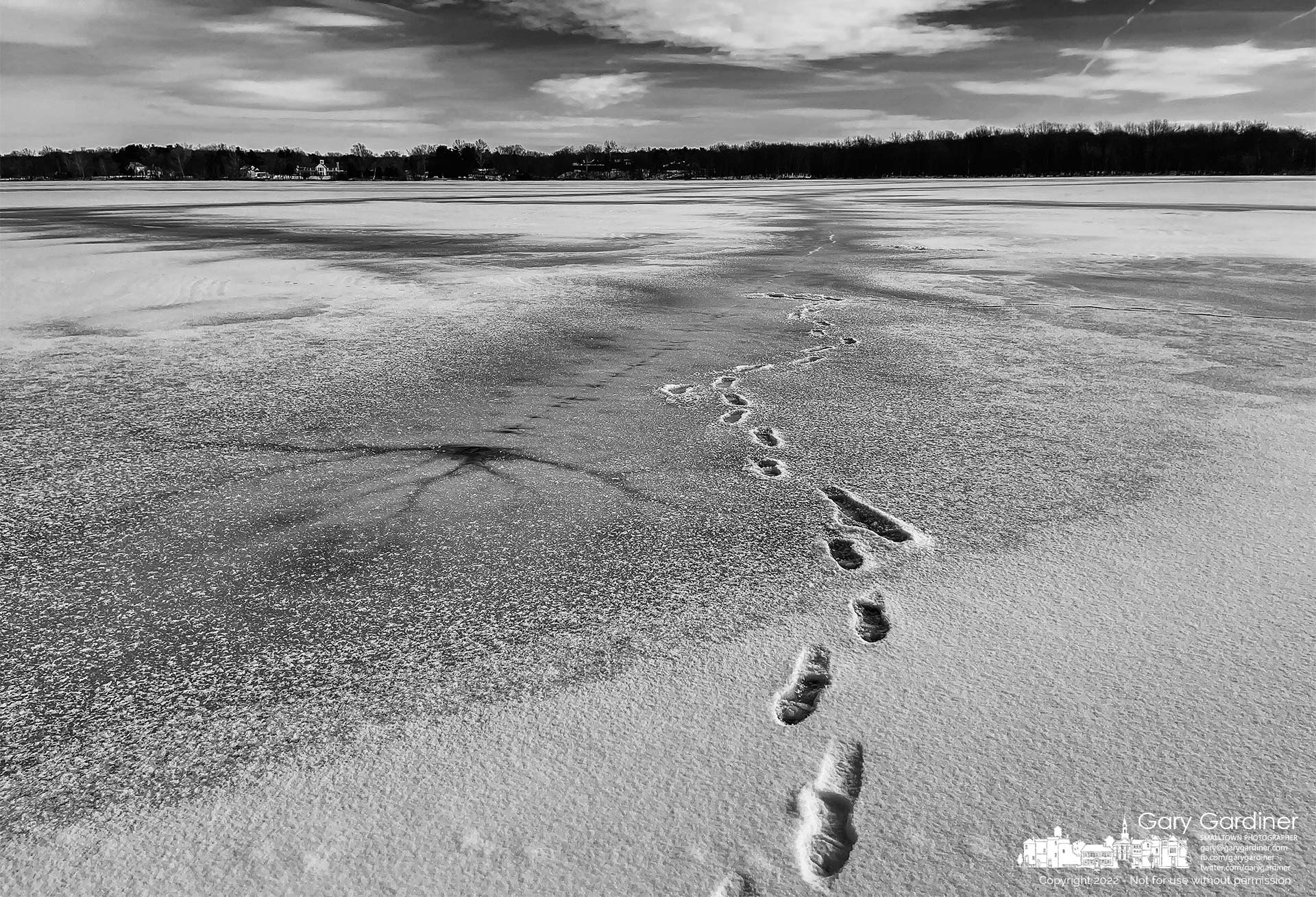 A set of tracks lead to the shore from the frozen and snow-covered surface of Hoover Reservoir at Red Bank Park. My Final Photo for Jan. 27, 2022.