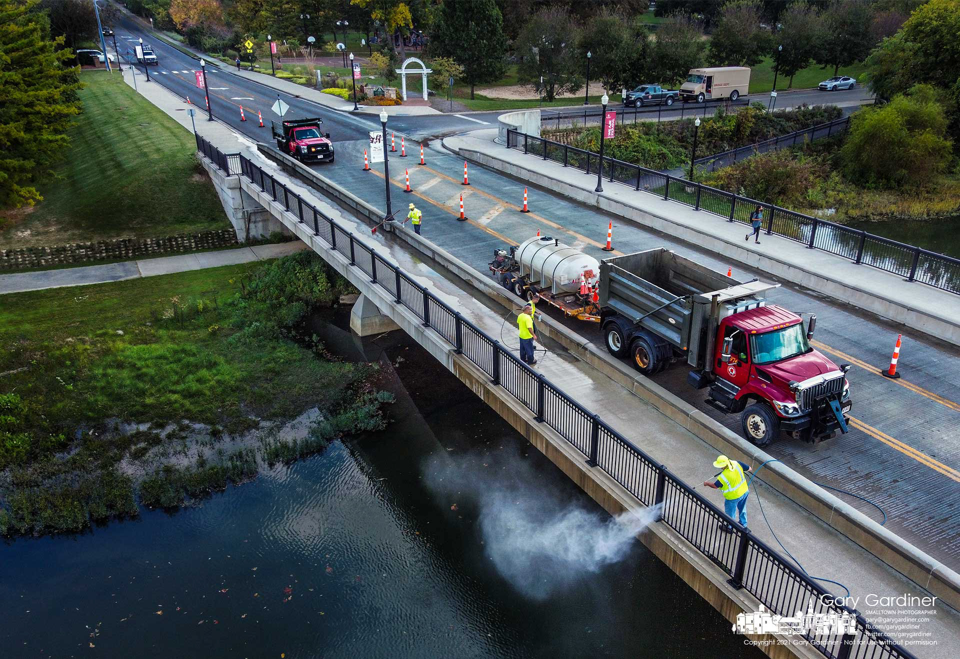 A Franklin County work crew pressure washes the Main Street bridge sidewalks and railing in preparation for sealing the sidewalks on the 10-year-old bridge. My Final Photo for Oct.14, 2021.