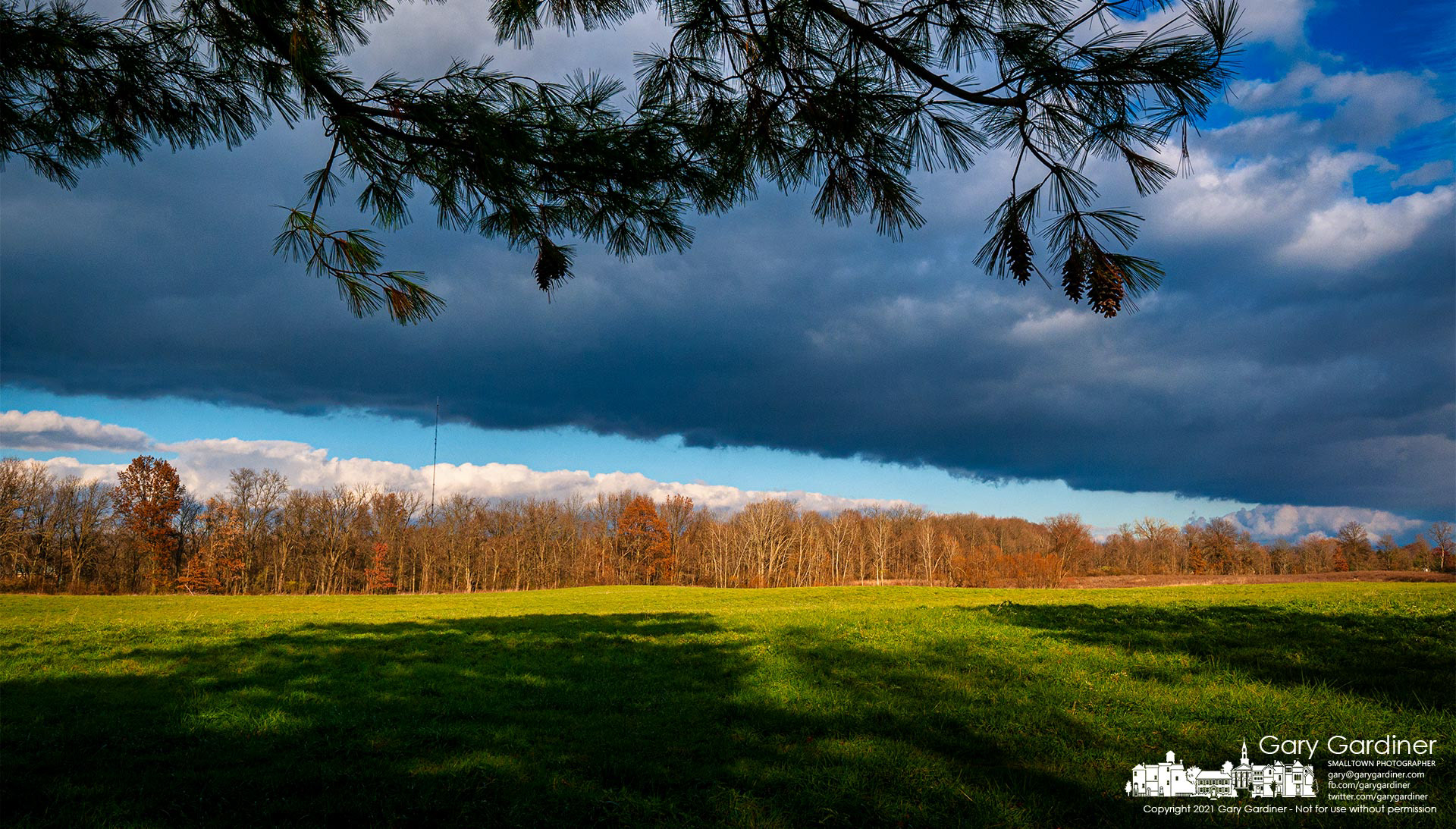 A patch of storm clouds breaks open to permit the afternoon sun to brighten for fields and forest at the Sharp Farm on Africa Road. My Final Photo for Nov. 28, 2021.