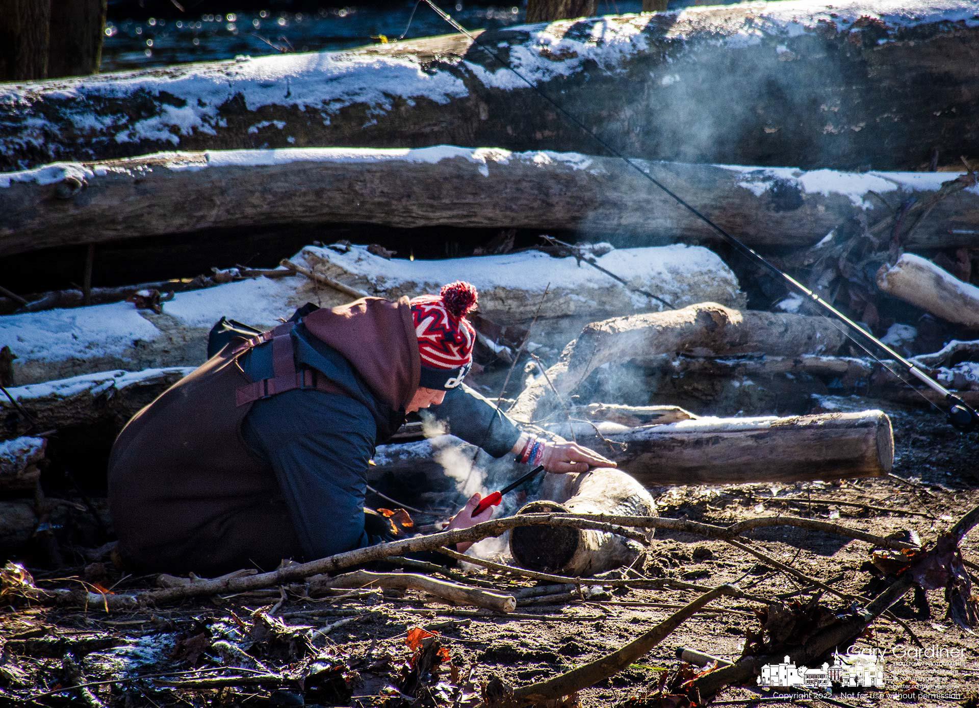 The frosty breath of a fisherman blows on what he hopes will become a fire to warm himself and his two fishing companions on the island in Alum Creek just below the lowhead dam at Alum Creek Park. My Final Photo for Jan. 8, 2022.