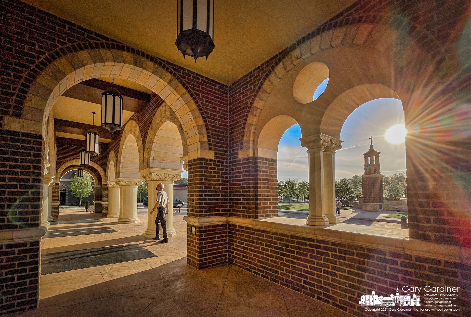 Parishioners enter St. Paul the Apostle Catholic Church as the sun brightens the arrivals for the first Mass on Sunday. My Final Photo for May 2, 2021.