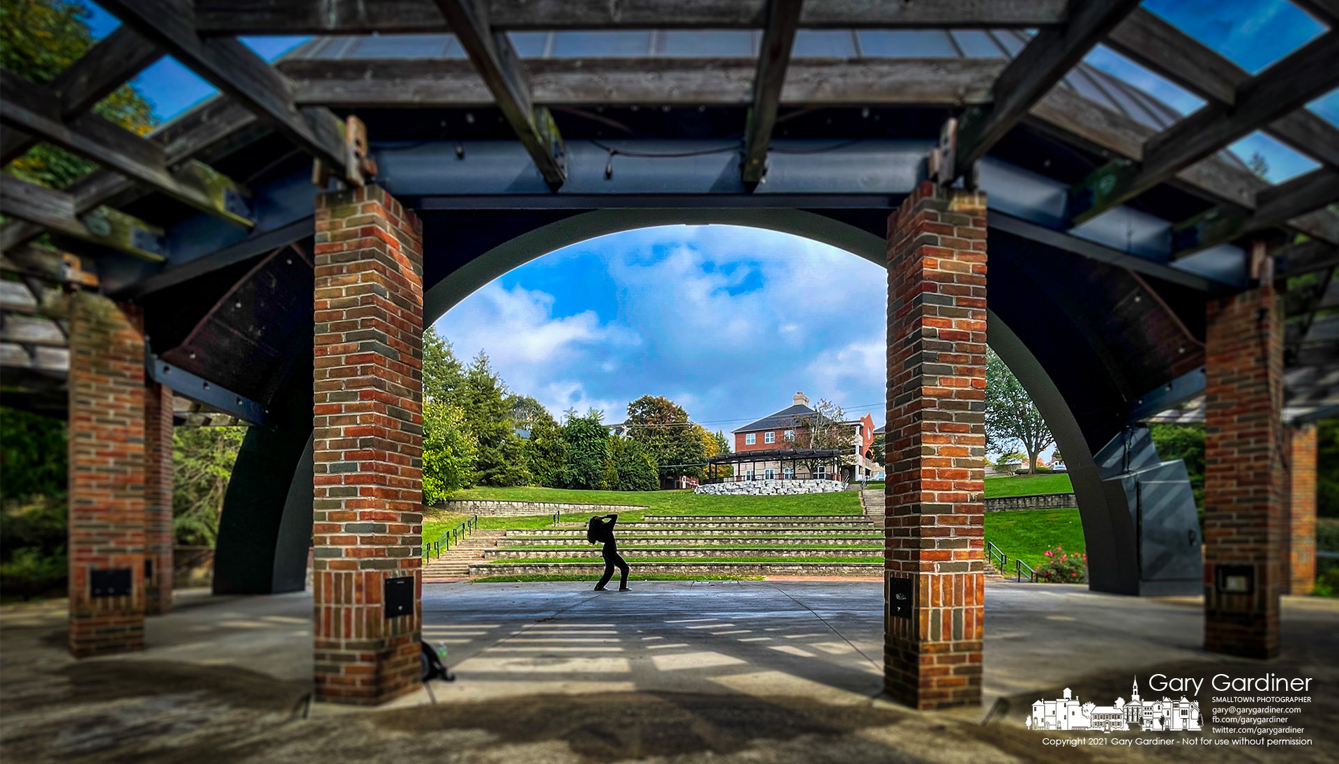 A young woman performs with great enthusiasm on an empty stage to an empty amphitheater in an empty park Thursday afternoon in Westerville. My Final Photo for Oct. 21, 2021.