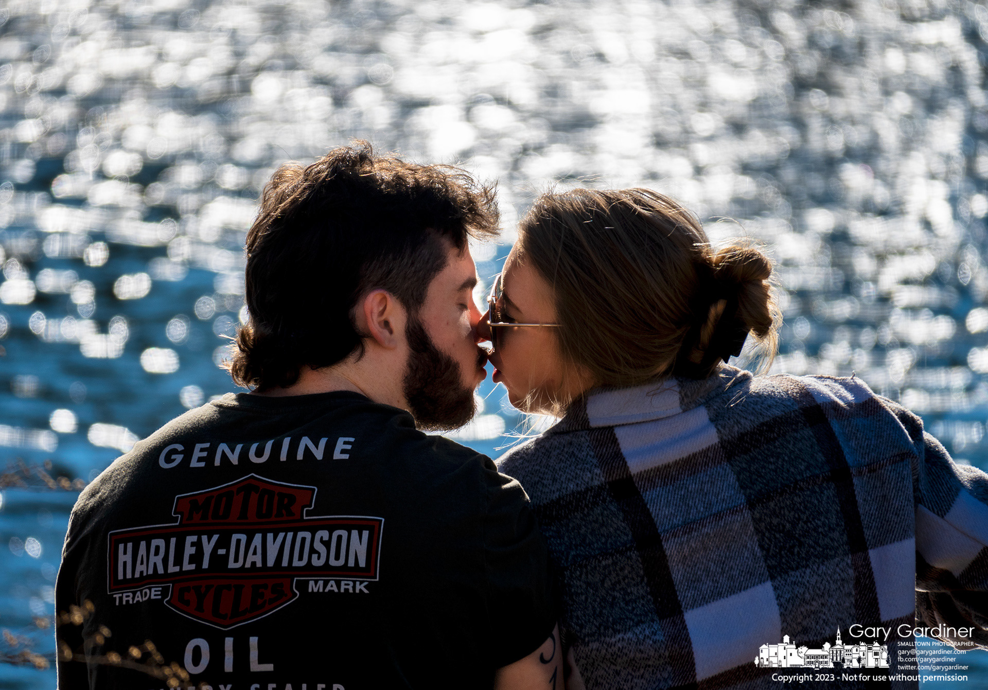 A couple finishes their picnic meal with a kiss after dining with their feet hanging off the rock wall at the Alum Creek Park North low-head dam. My Final Photo for February 12, 2023. 