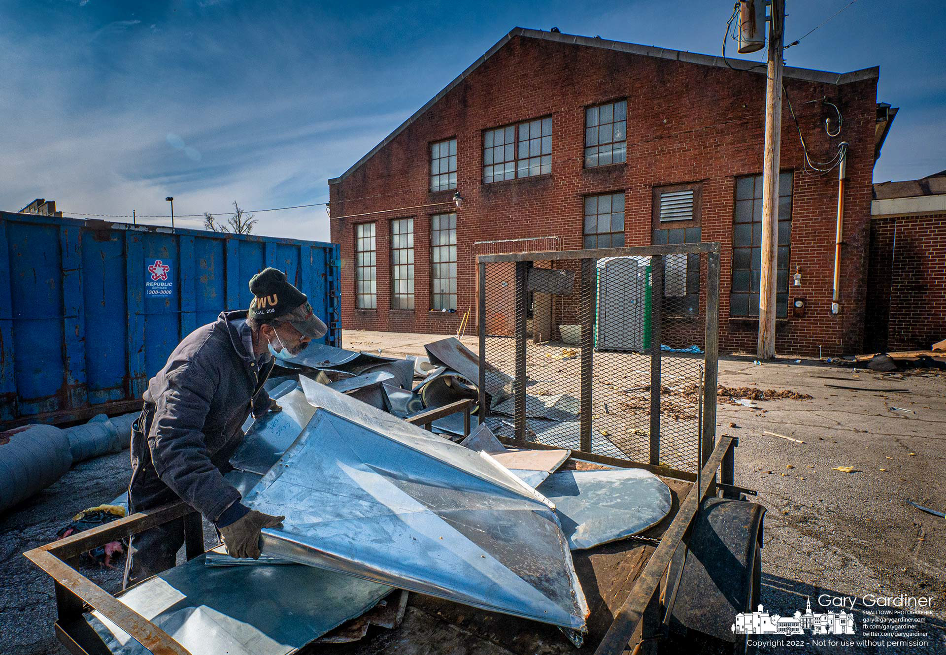 A scrapper loads metal ductwork removed during the renovation of the Westerville Armory into a COhatch office, restaurant, and brewpub. My Final Photo for Jan. 13, 2022.
