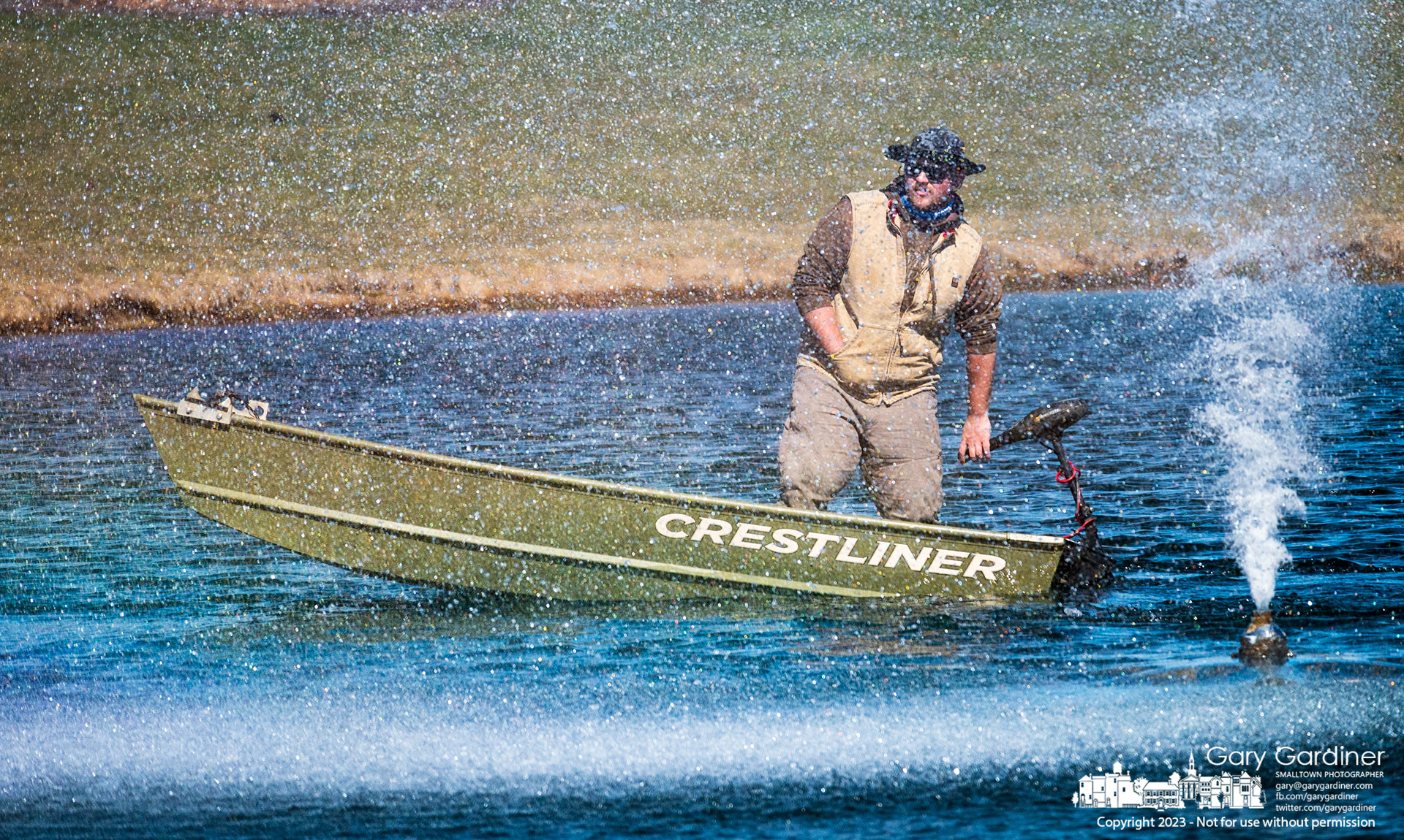 A contractor checks lighting in one of the fountain sprayers he installed in the pond in front of the Westerville Community Center on Cleveland Ave. as the city park system prepares itself for Spring. My Final Photo for March 7, 2023.
