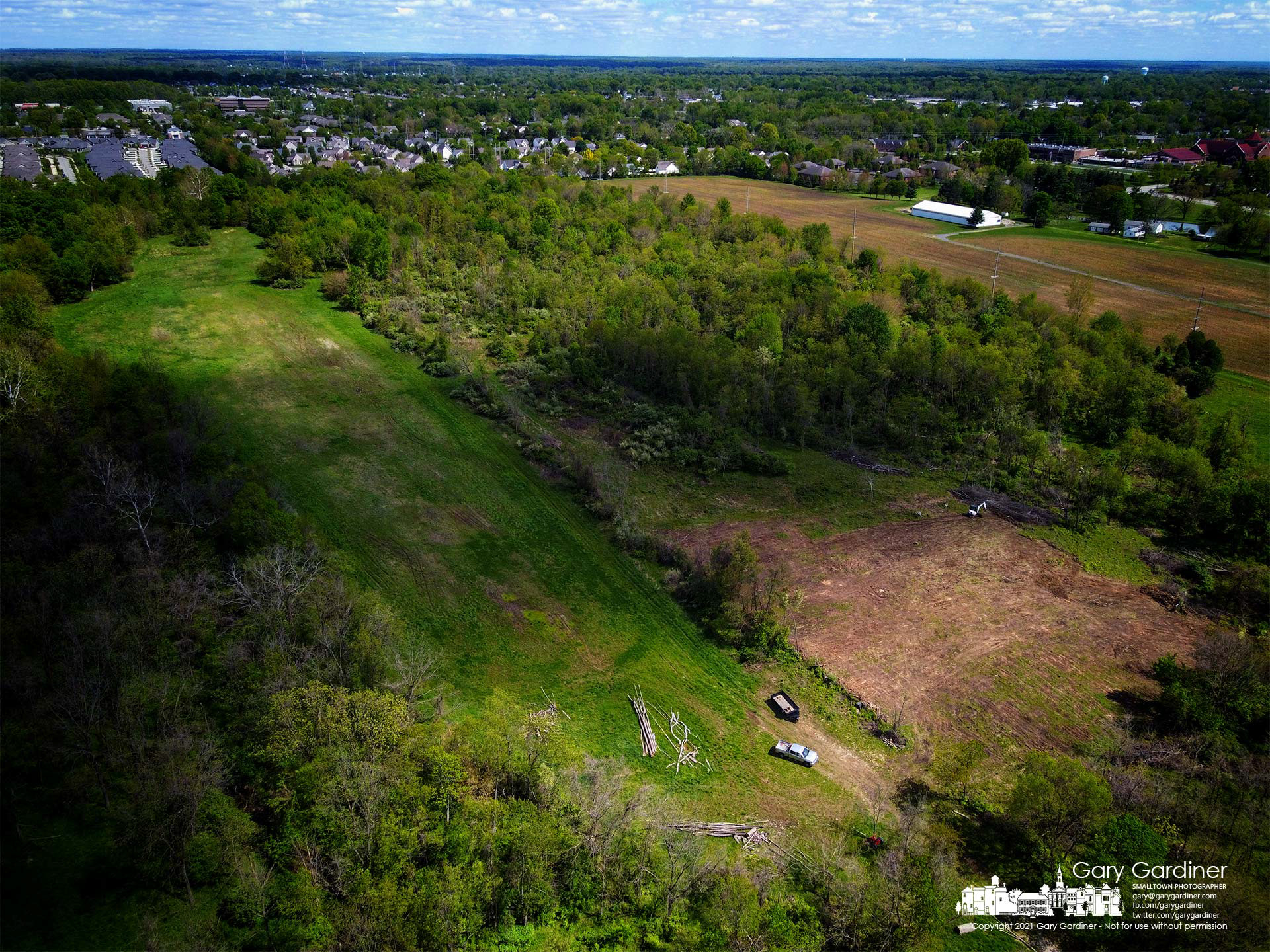Cloud shadows drift over a section of woods on Africa Road that once was used for cattle grazing before being turned to forest is cleared to turn the woods into a field again for raising crops. My Final Photo for May 8, 2021.