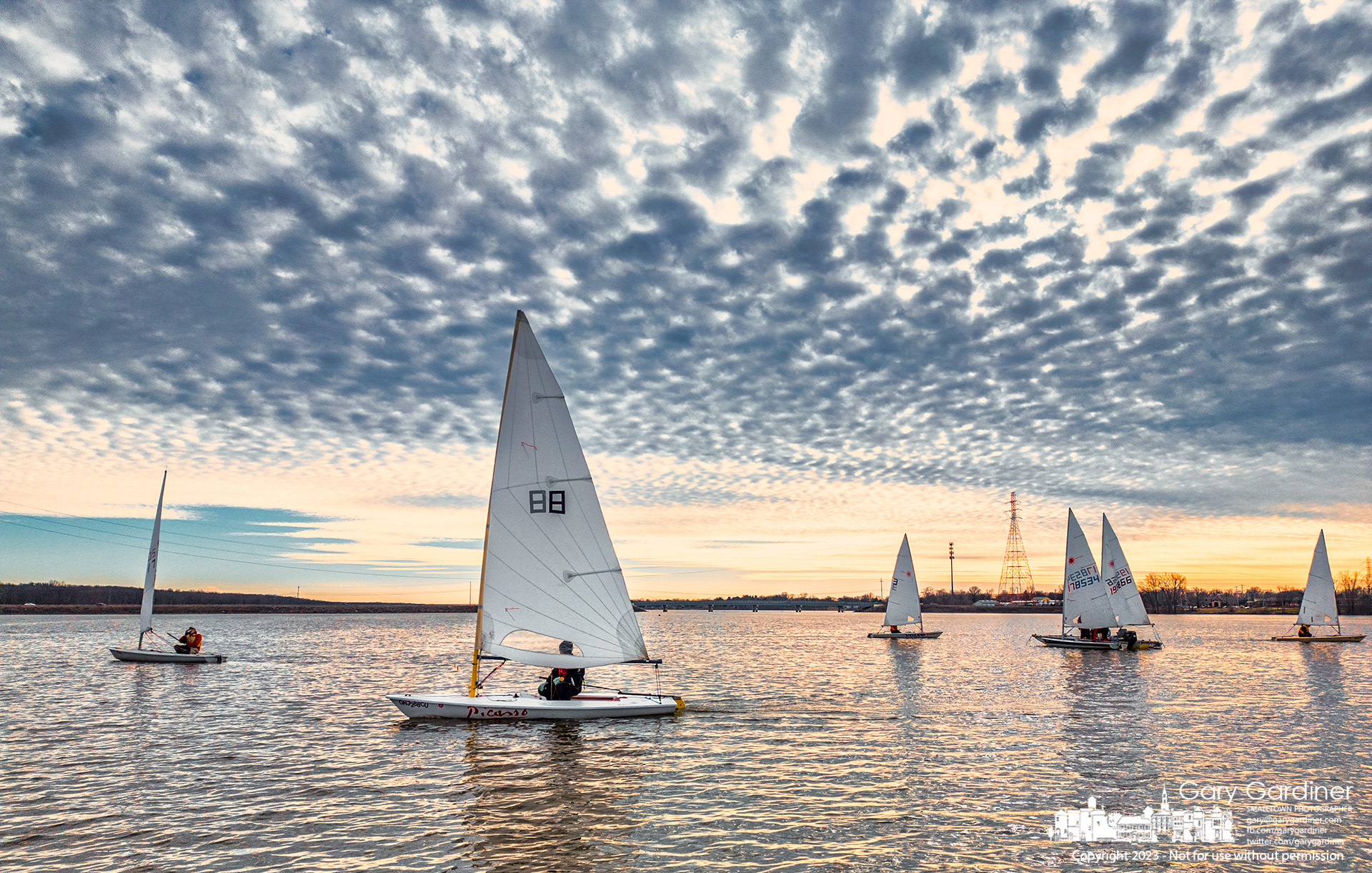 Winter sailors steer their craft across the mild waves of Hoover Reservoir working their way to the completion of a set of friendly races before the setting sun darkens their course. My Final Photo for January 28, 2023. 