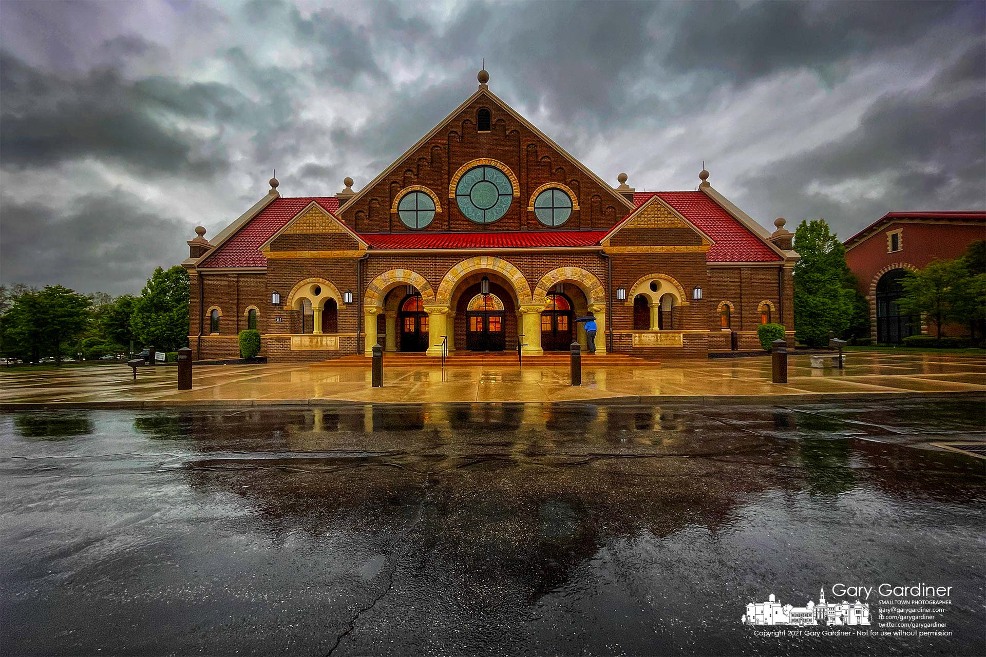 A parishioner arrives on a rainy morning for Mass at St. Paul the Apostle Catholic Church. My Final Photo for May 9, 2021.