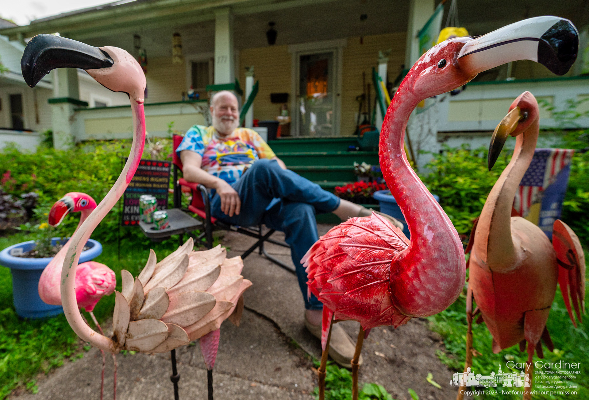A quarter of flamingos grace the front yard of a home on Vine Street during its fourth Art Walk where the neighborhood displays art, performs music, and provides games and food for visitors. My Final Photo for May 21, 2023. 