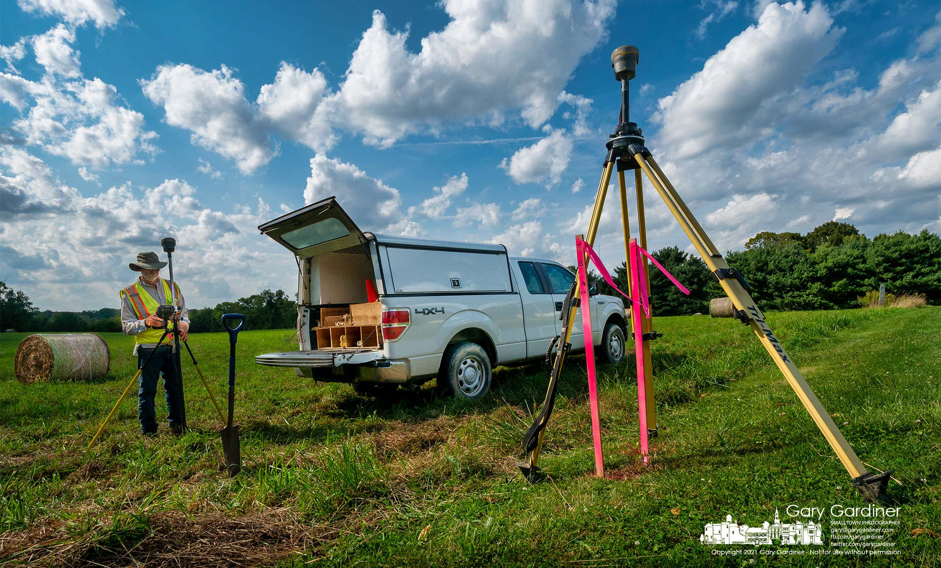 A surveyor returns tools to his truck at the end of his day beginning to mark the corners and elevation of about 14 acres on North West Street that was approved by the planning commission for the development of 88 townhomes. My Final Photo for Sept. 14, 2021.
