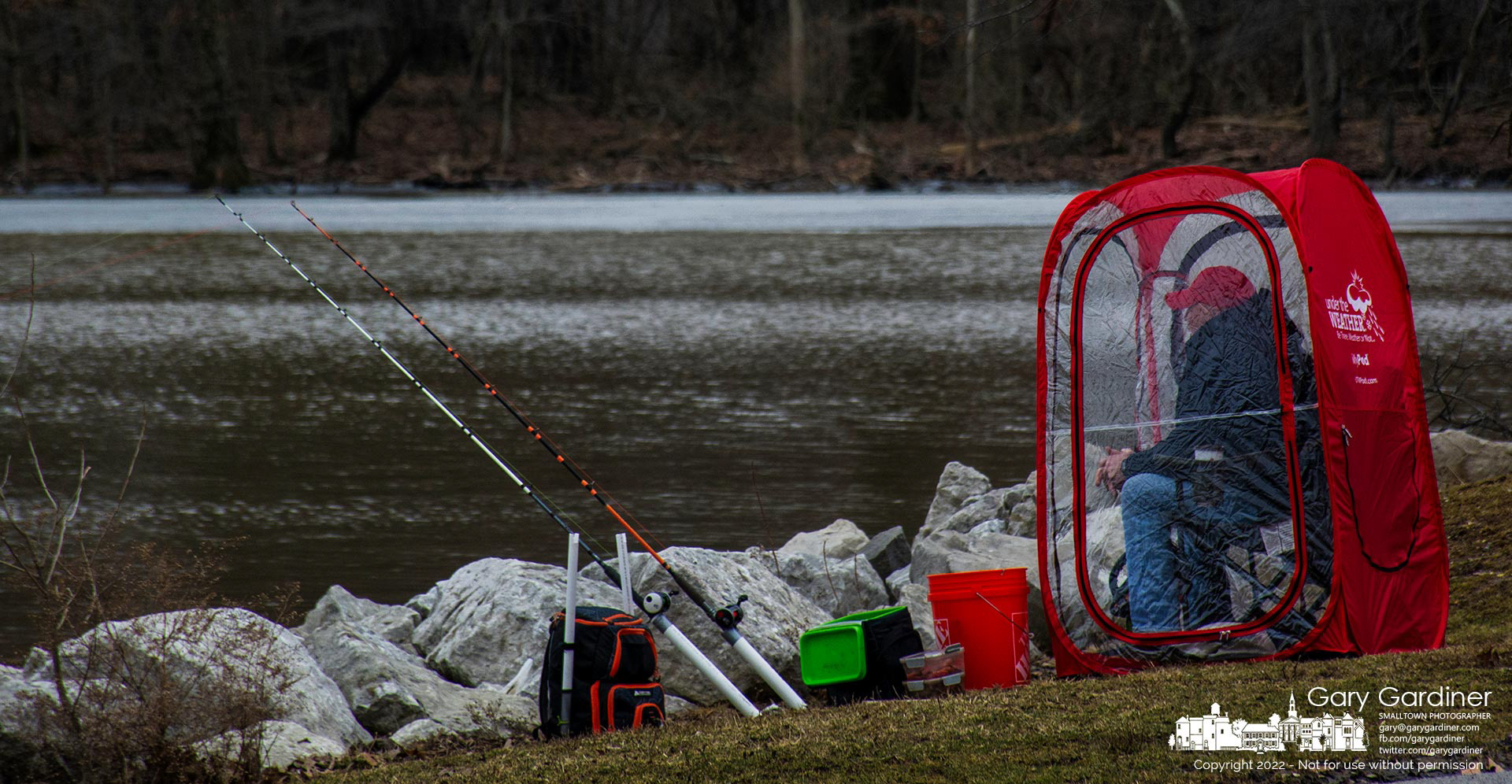 A fisherman sits inside a zippered all-weather shelter where he spent part of his Saturday afternoon fishing in a section of Hoover Reservoir that did not have a layer of ice. My Final Photo for Feb. 26, 2022.