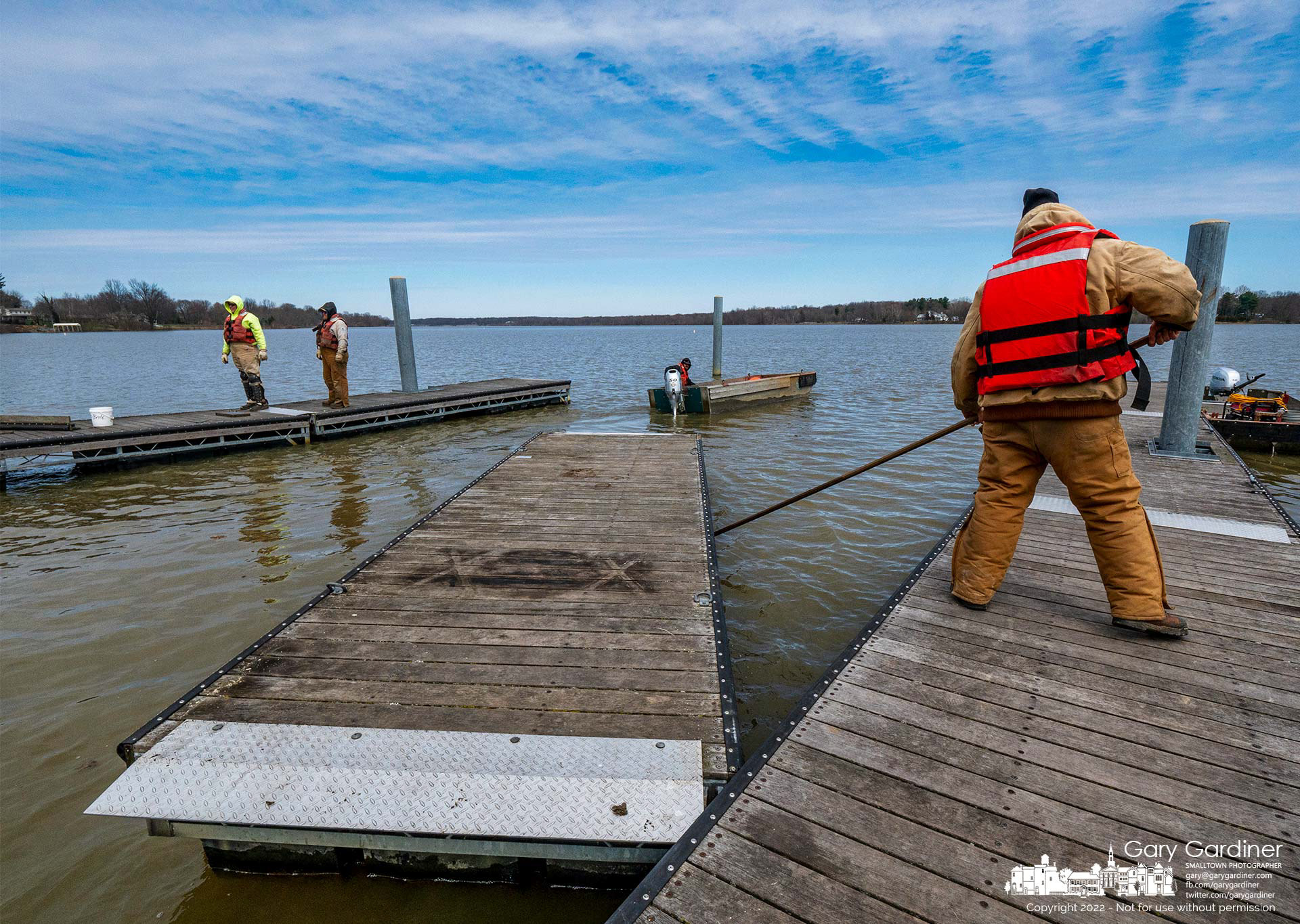 Workers install docks at the boat ramp at Red Bank on Hoover Reservoir beginning the task of installing docks on all the ramps on Hoover as warmer weather begins the spring and summer season. My Final Photo for March 29, 2022. 