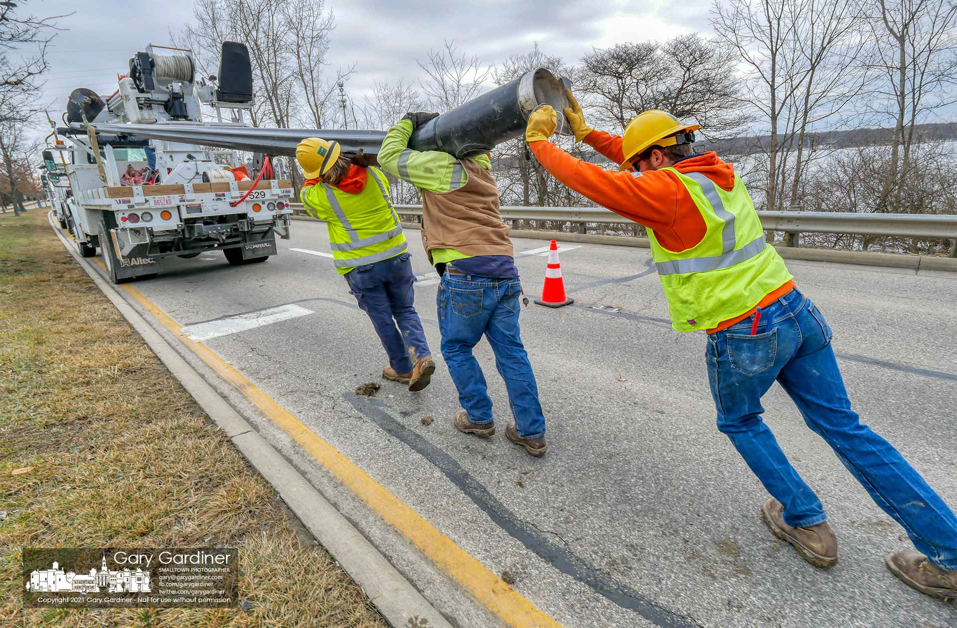 City electric crews remove a streetlight pole that was broken at its base recently in a car crash on Sunbury Road near East College. Ave. My Final Photo for Feb. 24, 2021.