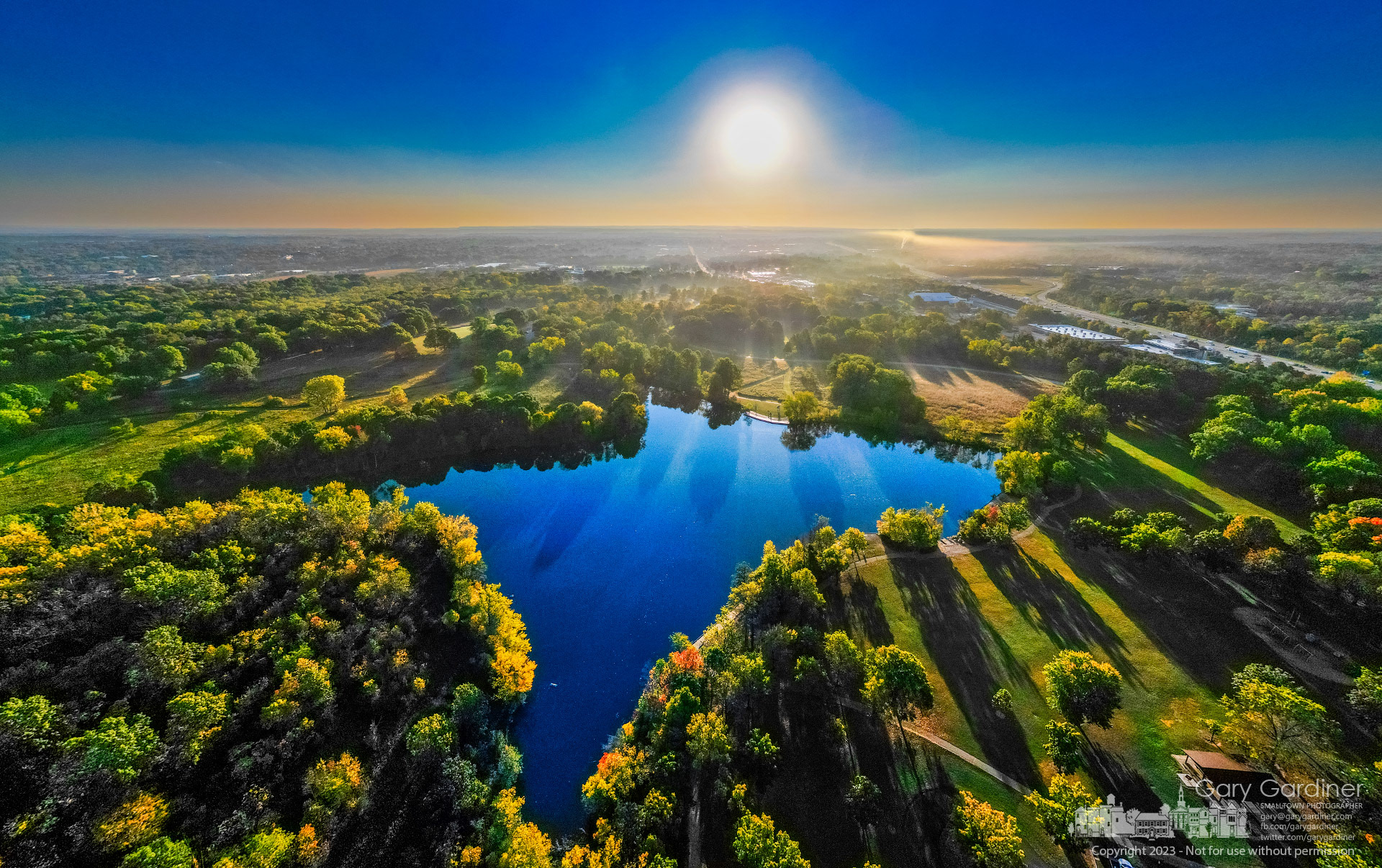 Shadows from the morning sun lay across Schrock Lake and Sharon Woods Metro Park as the fog begins to evaporate on what will be a hot fall day. My Final Photo for October 2, 2023. https://bit.ly/3EYD9yX
