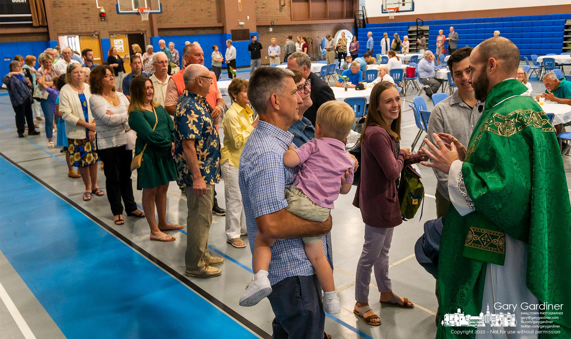 Parishioners line up to speak with Fr. Brandimarti on his final day at St. Paul the Apostle Catholic church before being transferred to be the Parochial Vicar of St. Vincent de Paul Church in Mt. Vernon and St. Luke Church in Danville. My Final Photo for July 10, 2022.