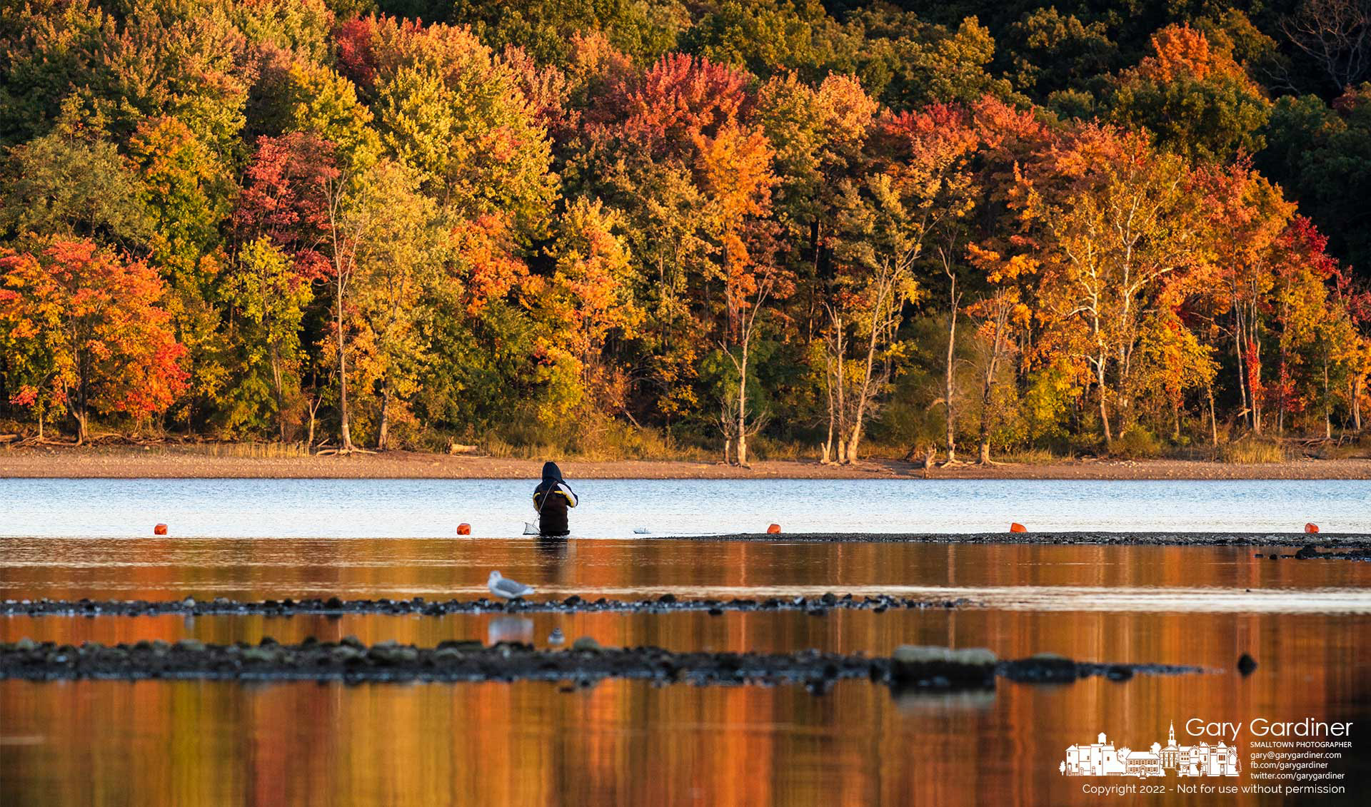 A fisherman wades into Hoover Reservoir hoping for better luck and more fish on a lazy, calm Sunday afternoon. My Final Photo for October 9, 2020.