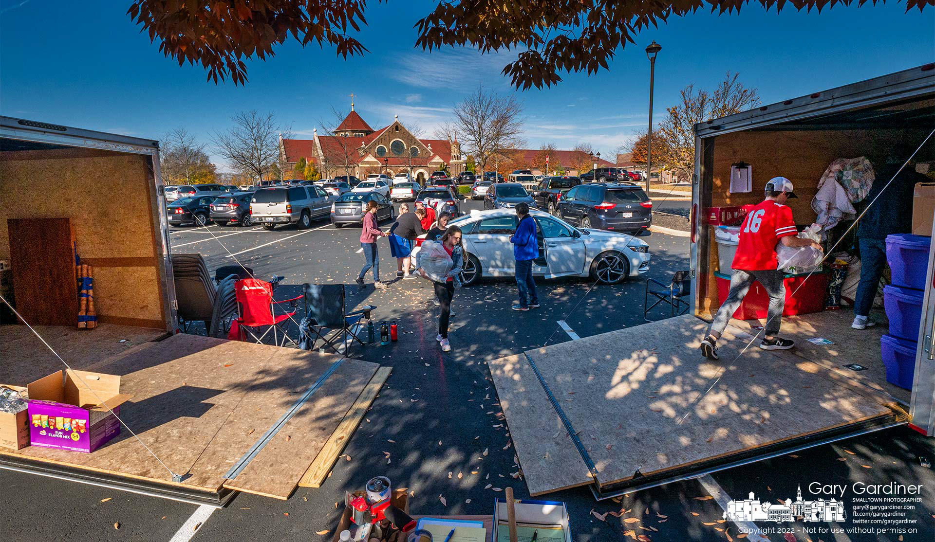 A volunteer crew collects donated household goods in the parking lot at St. Paul the Apostle Catholic Church and loads them into trailers to be later sorted and cataloged for the St. Vincent DePaul Society's assistance programs. My Final Photo for October 23, 2022.