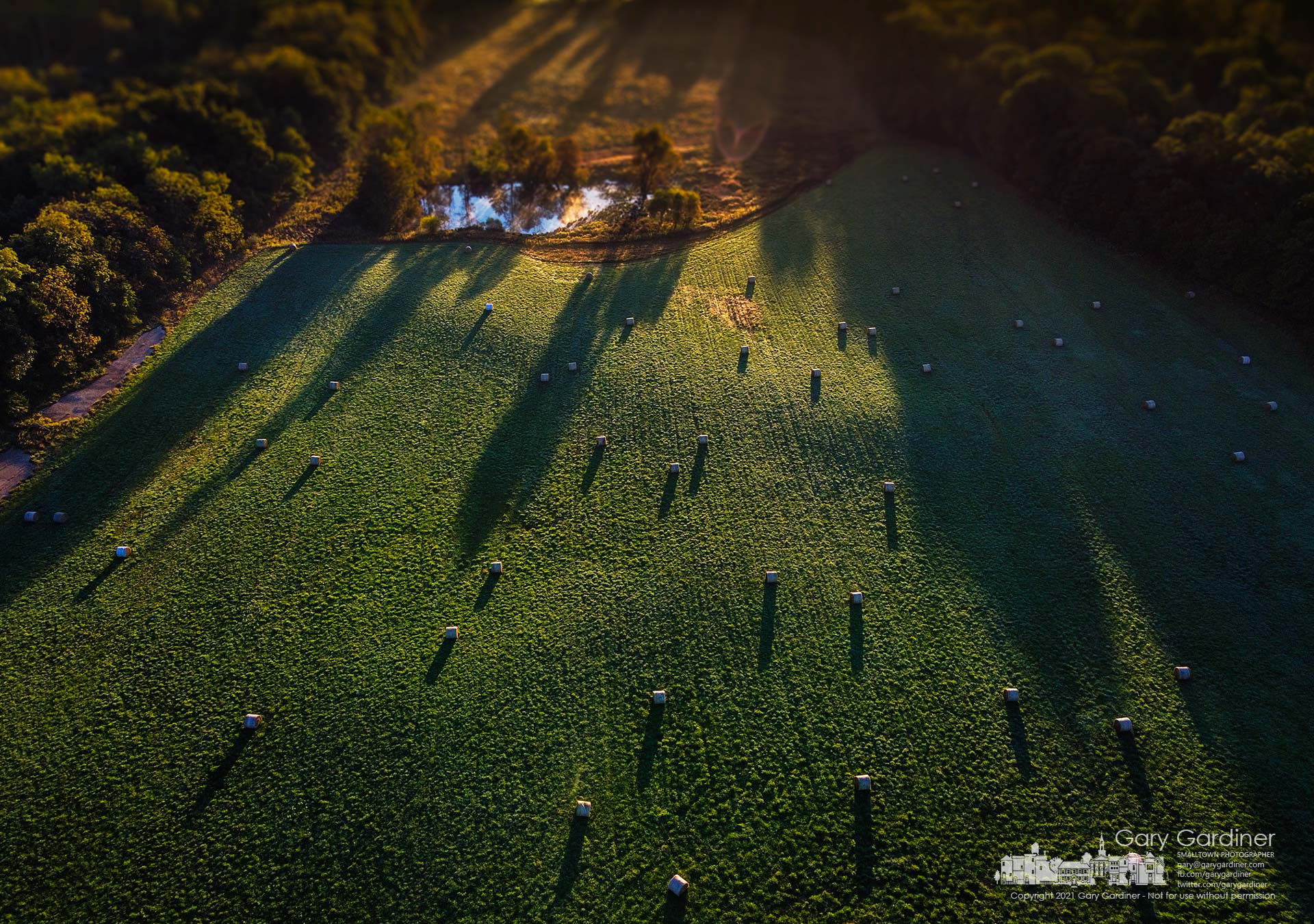 The morning sun casts shadows across the small pond, hayfield, and round bales on a section of the Sharp Farm on Africa Road. My Final Photo for Sept. 30, 2021.