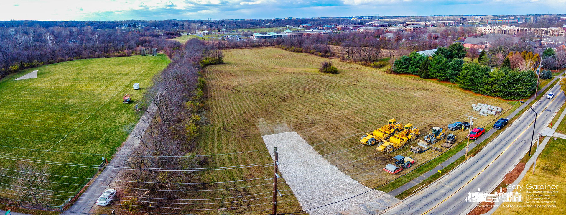 Earthmoving equipment sits at the front edge of a farm field where construction has started on a complex of townhomes on North West Street just west of Uptown Westerville. My Final Photos for November 18, 2022.