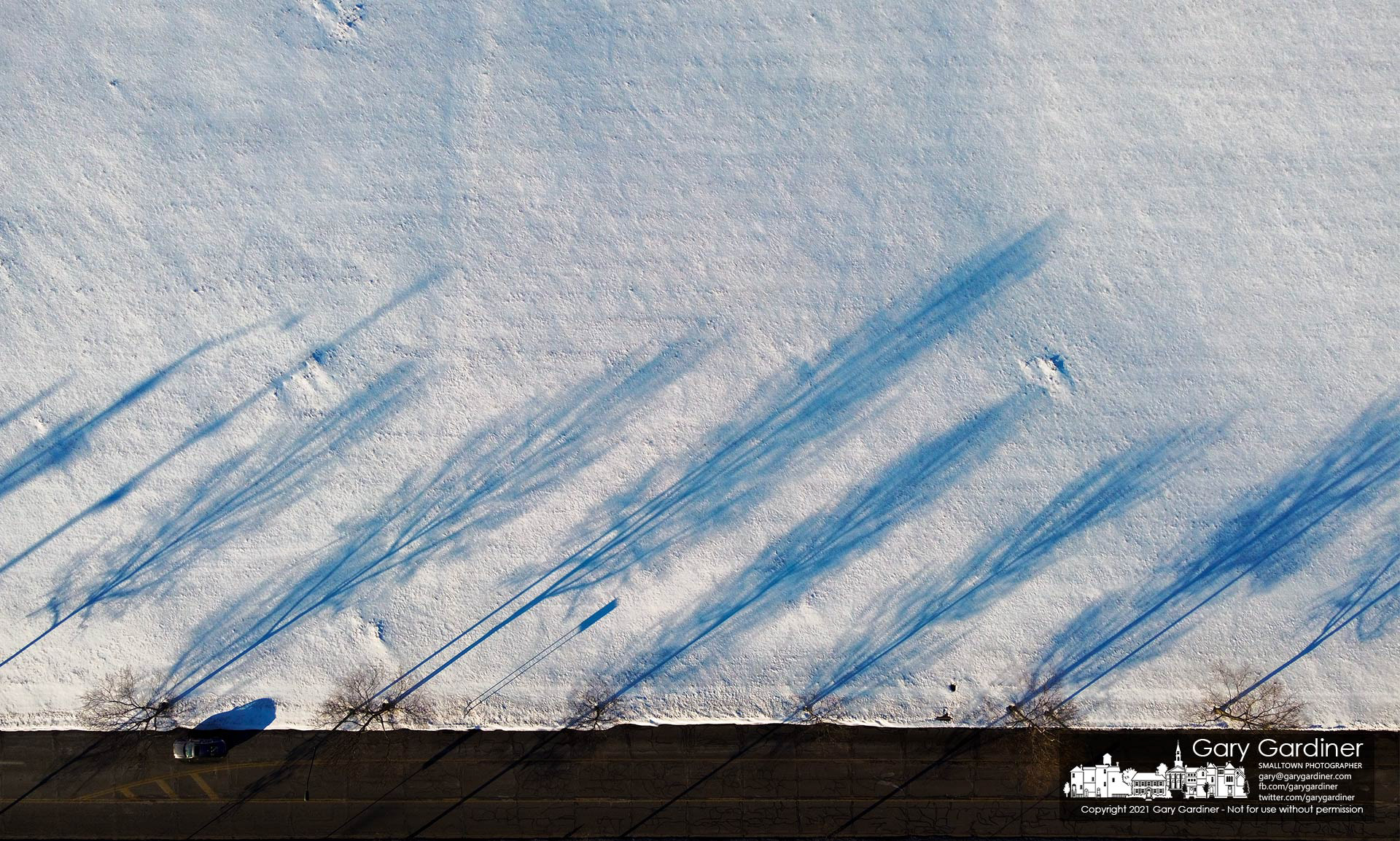 The late afternoon sun casts shadows over the snow-covered hayfield along Cooper Road near Cleveland Ave. My Final Photo for Feb. 3, 2021.