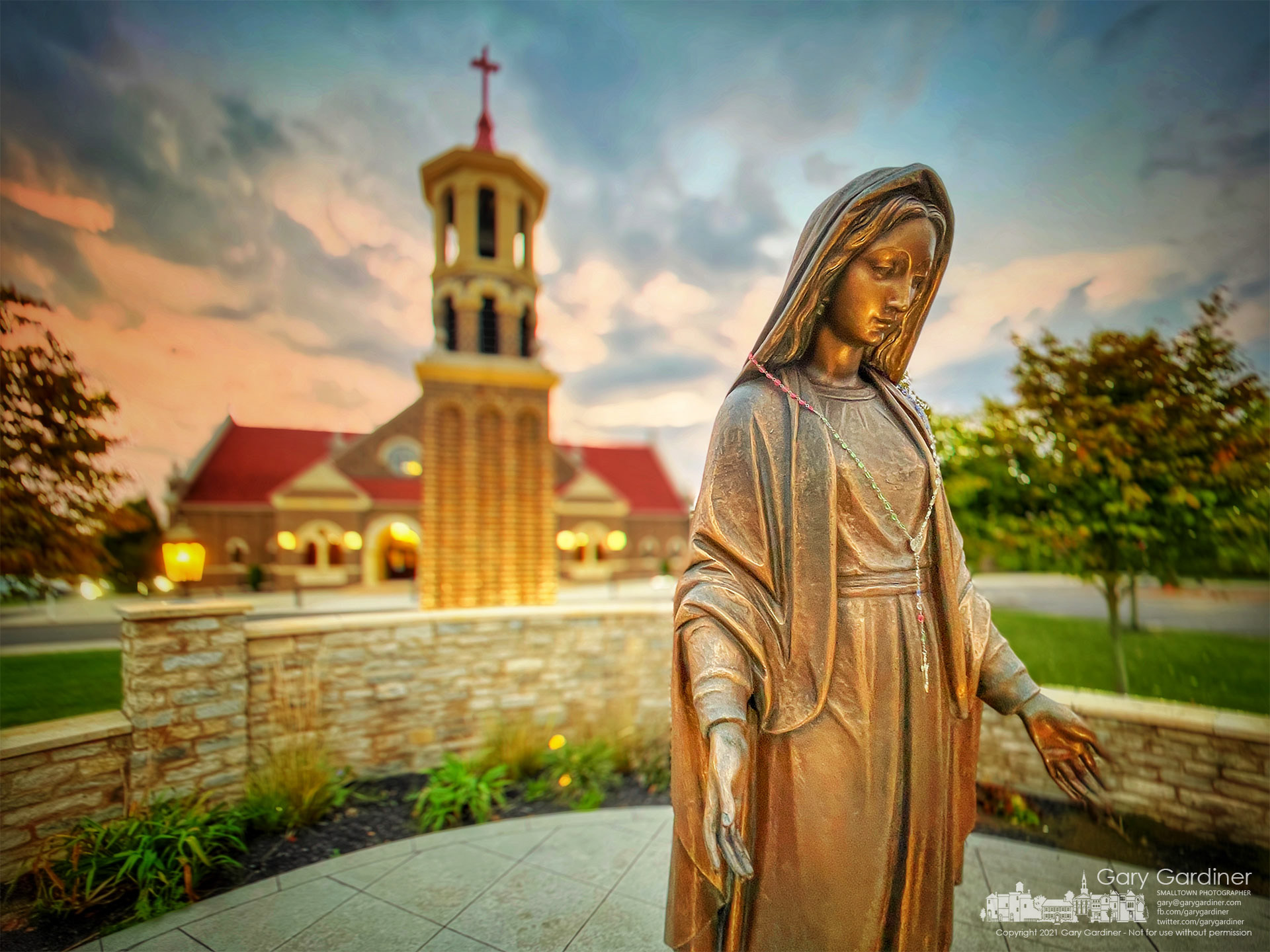 The statue of Mary near the entrance to St. Paul the Apostle Catholic Church is bathed in morning light at sunrise before the first Sunday Mass. My Final Photo for Oct. 10, 2021.