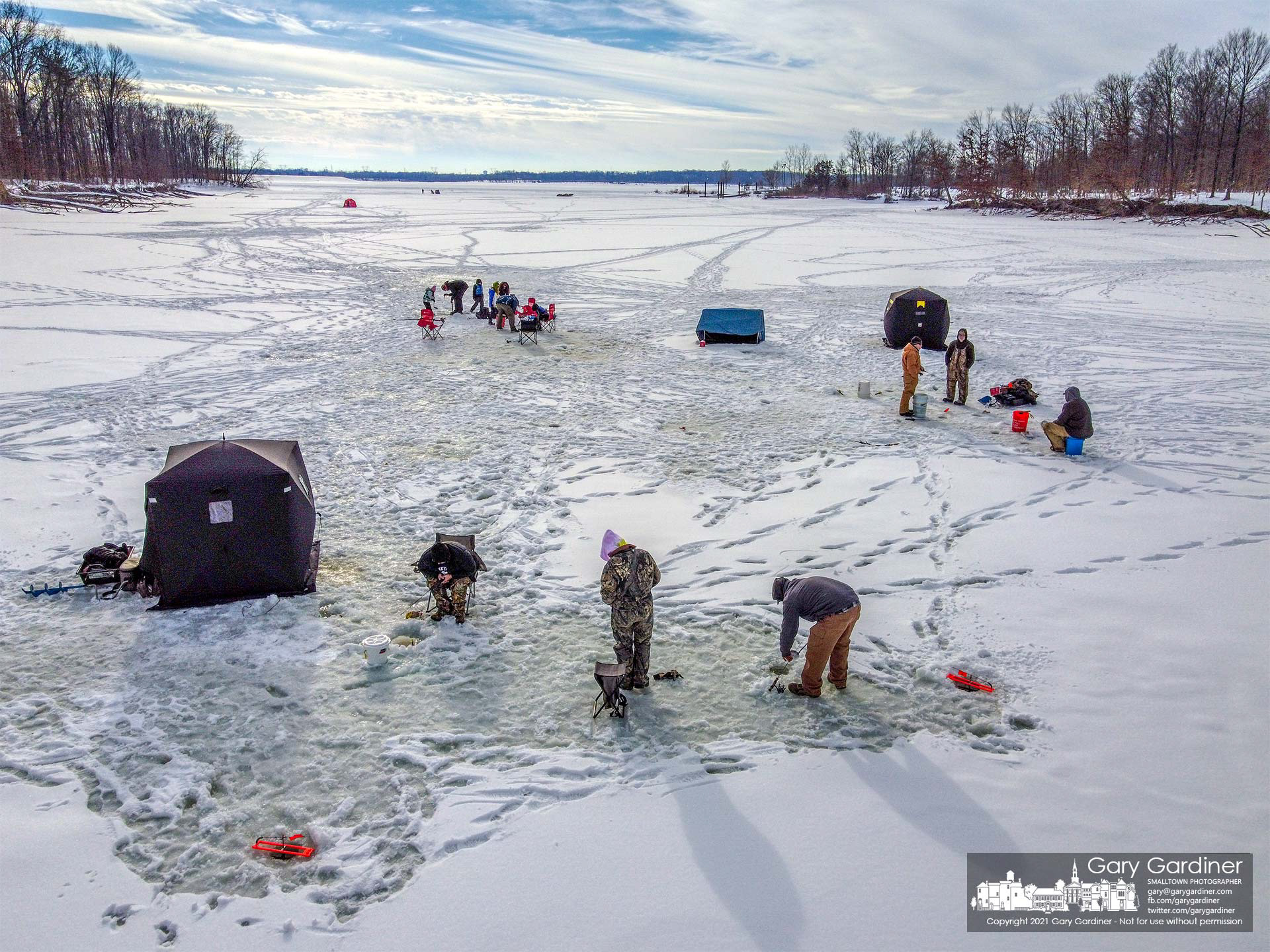 A group of anglers sets their lines and tents on thick ice on a small lagoon on Alum Creel Lake on Sunday as temperatures are forecast to warm up during the week. My Final Photo for Feb. 21, 2021.