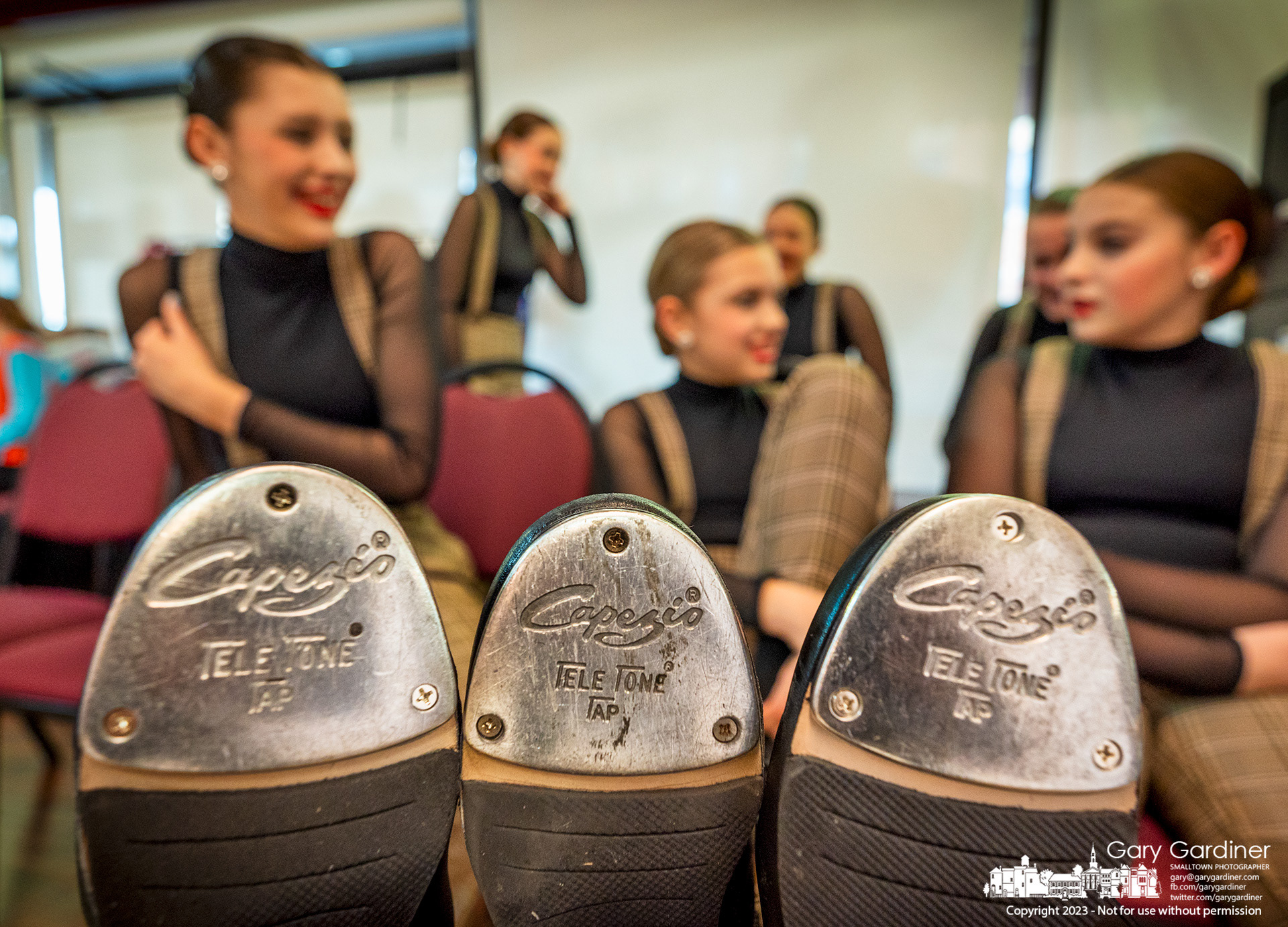 Generations dancers rest their tap-shoed toes as they wait their turn to have their photos made during the dance studio's annual photo week where all the dancers are photographed for each of the disciplines they learn. My Final Photo for March 8, 2023. 