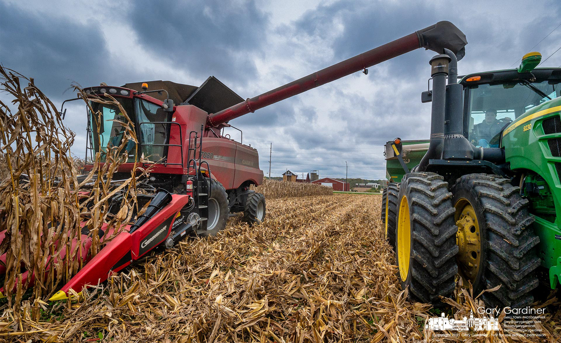 A combine and corn hauler crawl through one of the fields of corn on the Yarnell Farm hoping to harvest both fields before the end of the day and before rain arrives Saturday. My Final Photo for Oct. 22, 2021.