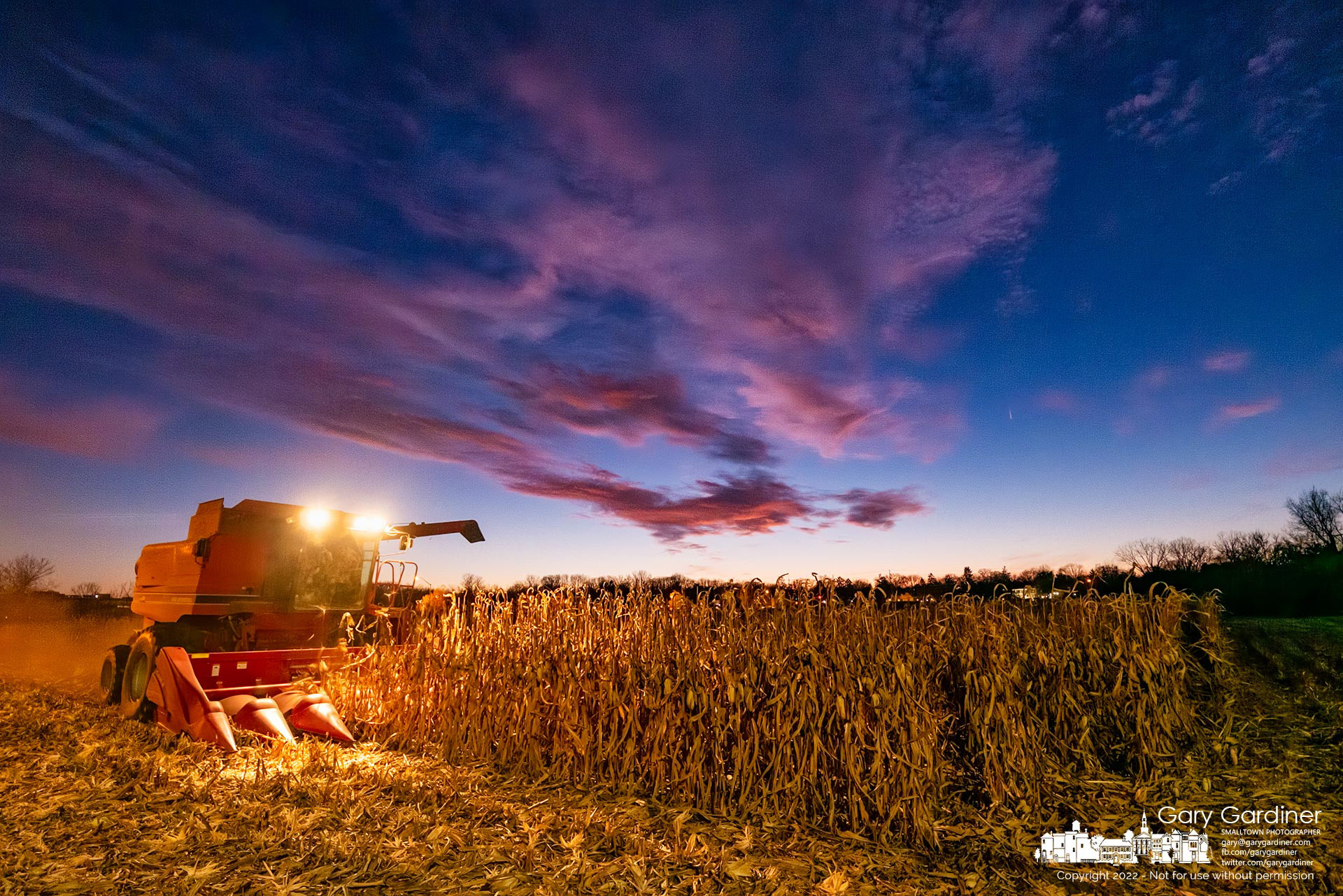 xAbout two hours after sunset with twilight still in the sky Kevin Scott harvests corn at the Braun Farm along Cooper and CollegeView Roads. My Final Photo for November 21, 2022.