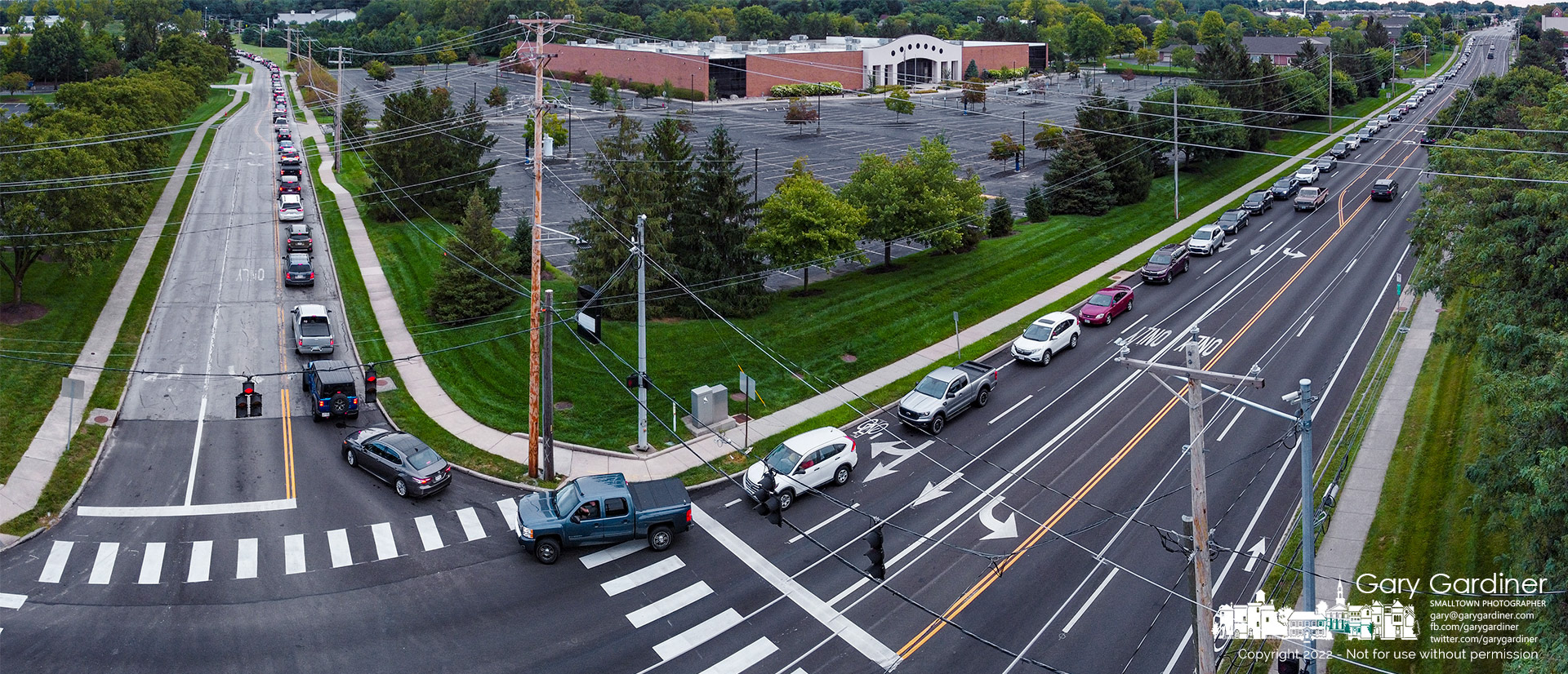 More than half a mile of cars line up on Park Meadow and Schrock Road early Saturday morning to drop off discarded household waste including tires, television, batteries, and paints at a one-day disposal site at the city garage. My Final Photo for Sept. 10, 2022.