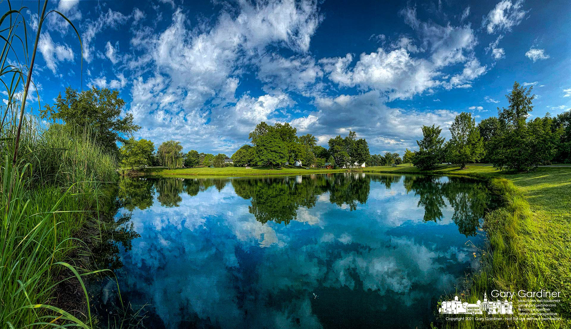 Clouds blowing in from the west greet the morning sun brightening the pond, trees, and buildings at Heritage Park in Westerville. My Final Photo for Aug. 12, 2021.