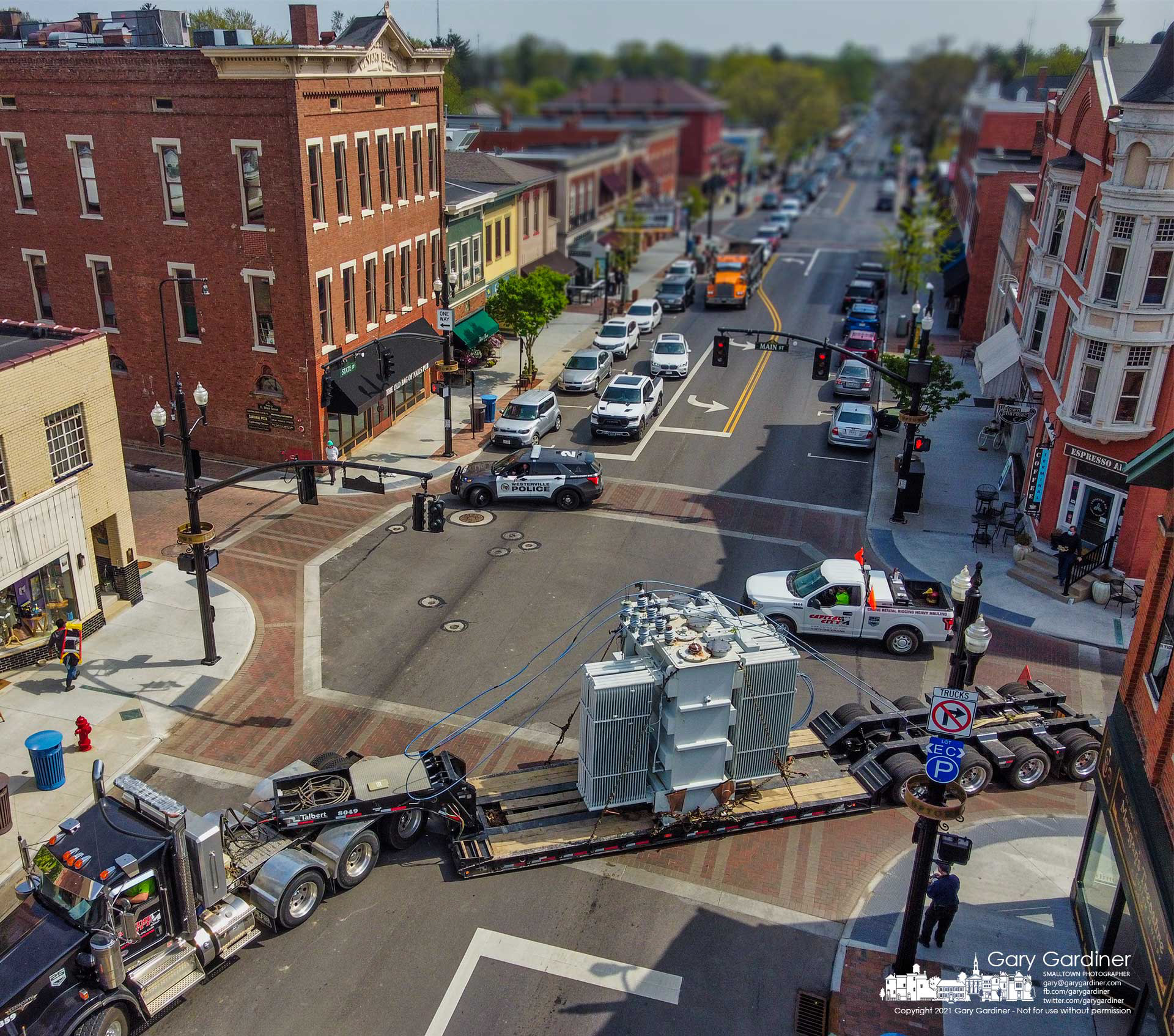A 65,000-pound transformer from the city electric substation on Collegeview moves through the State and Main intersection on its way to the substation at Maxtown and McCorkle where it will be stored as a backup. My Final Photo for April 20, 2021.